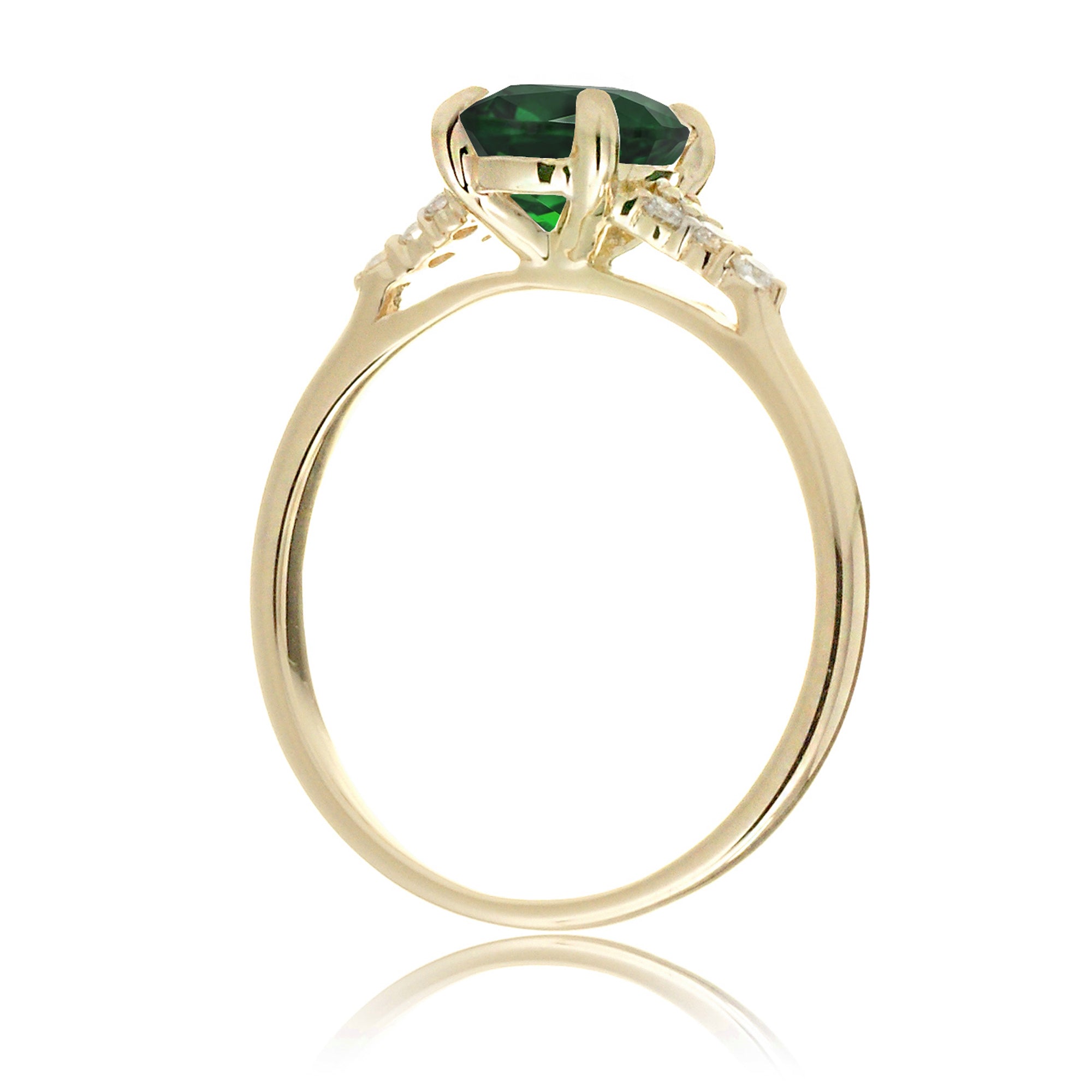 Emerald engagement ring with princess cut and diamond accent in yellow gold