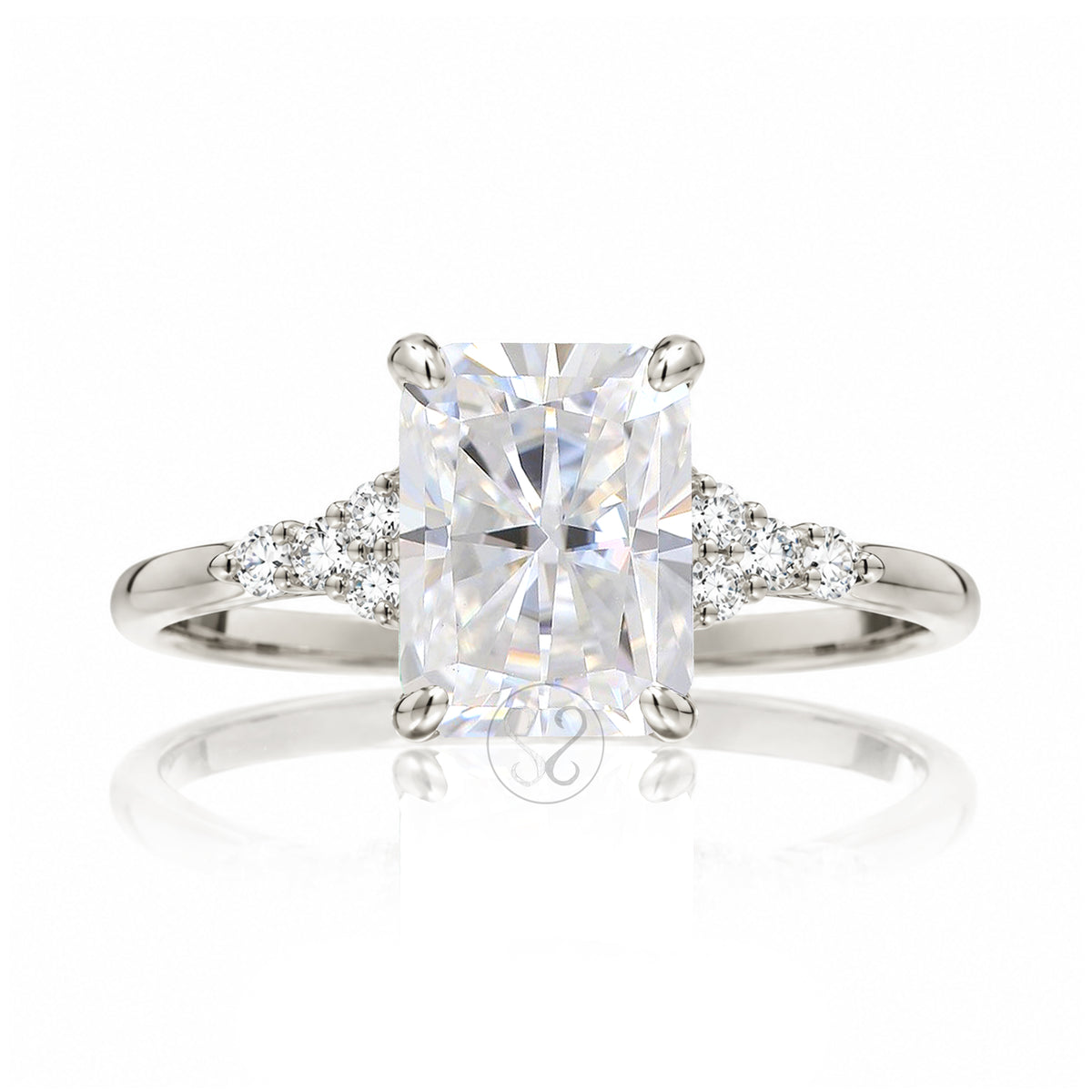 Radiant cut moissanite and diamond three stone ring in white gold