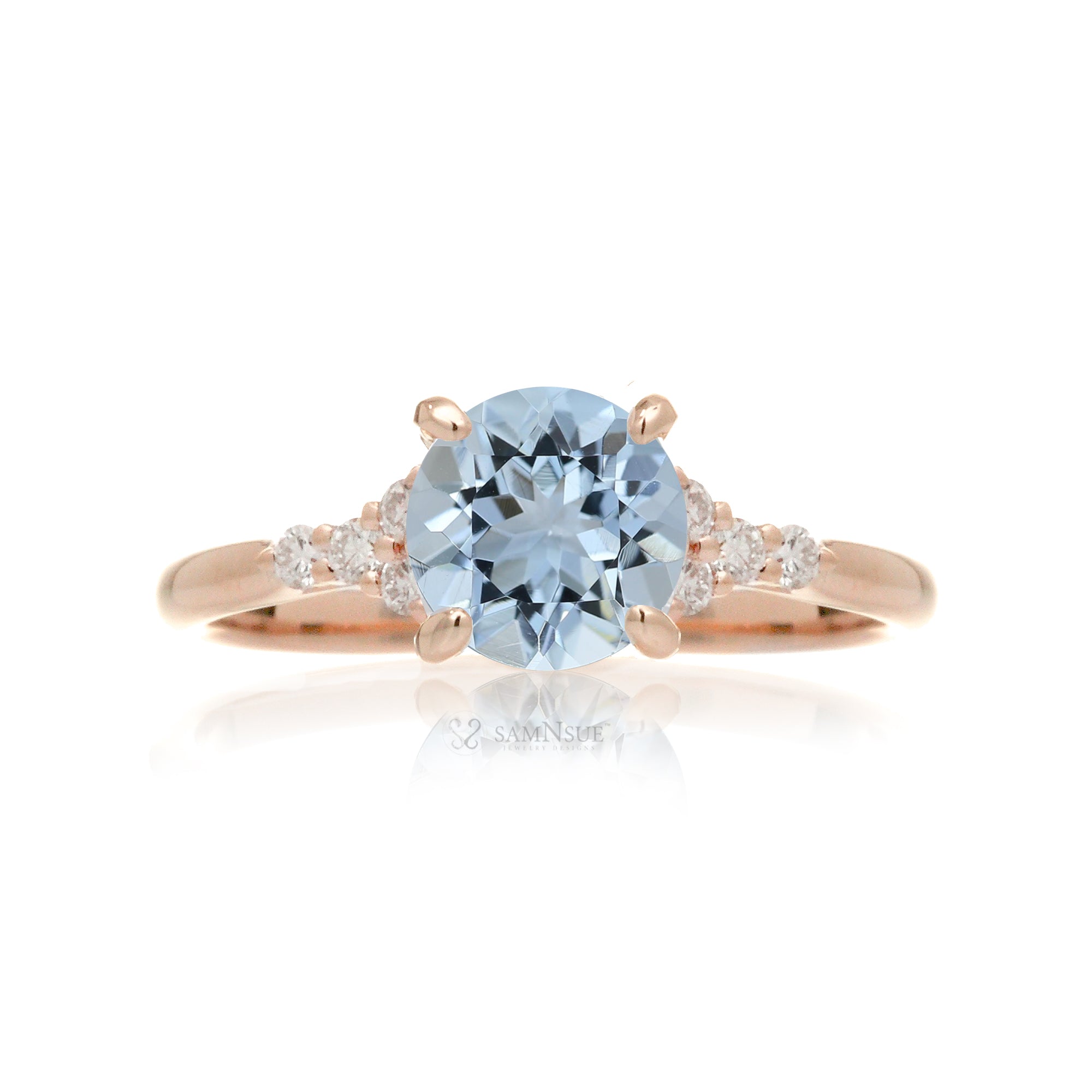 Round aquamarine three stone ring in rose gold