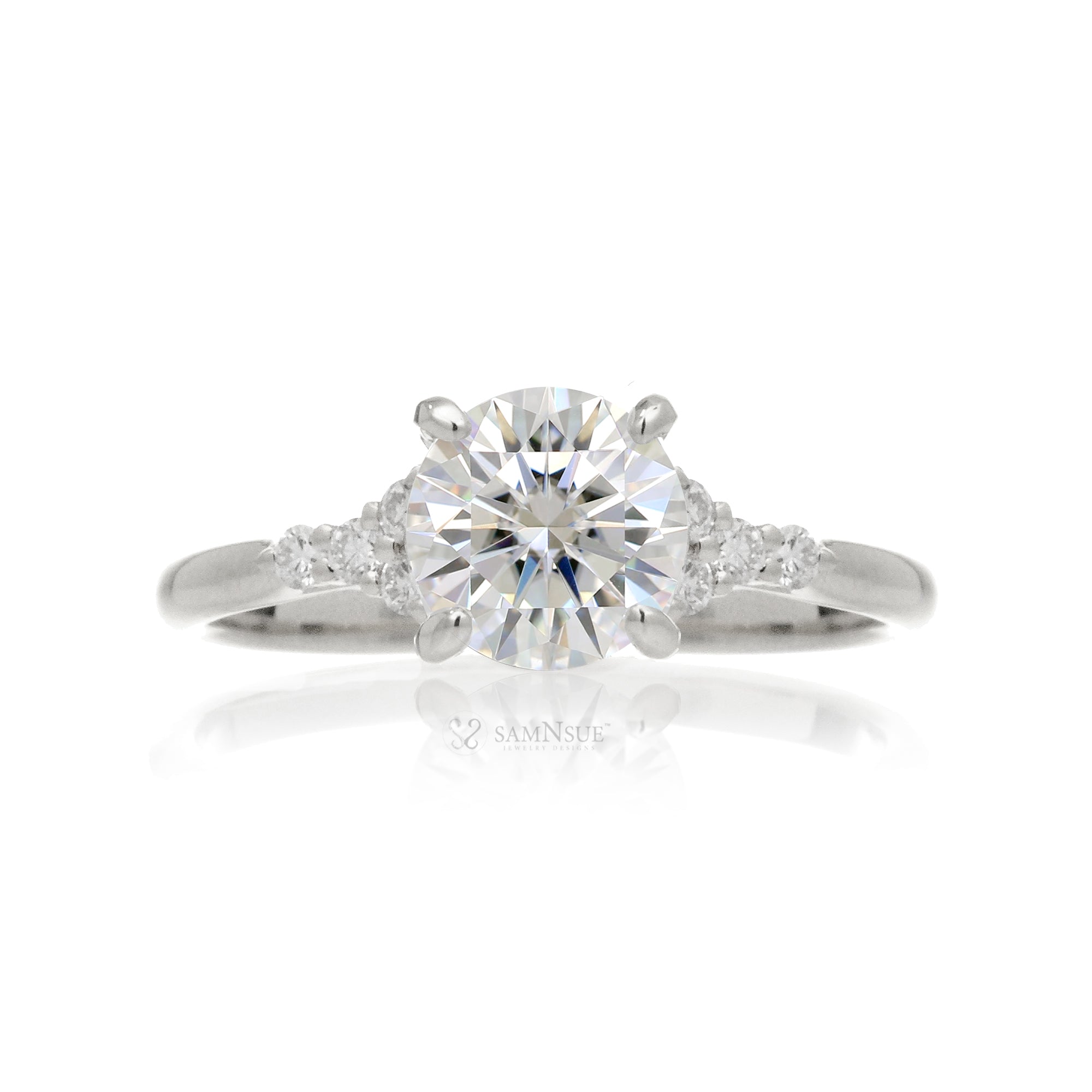 Round brilliant cut diamond engagement ring with rounded band in white gold