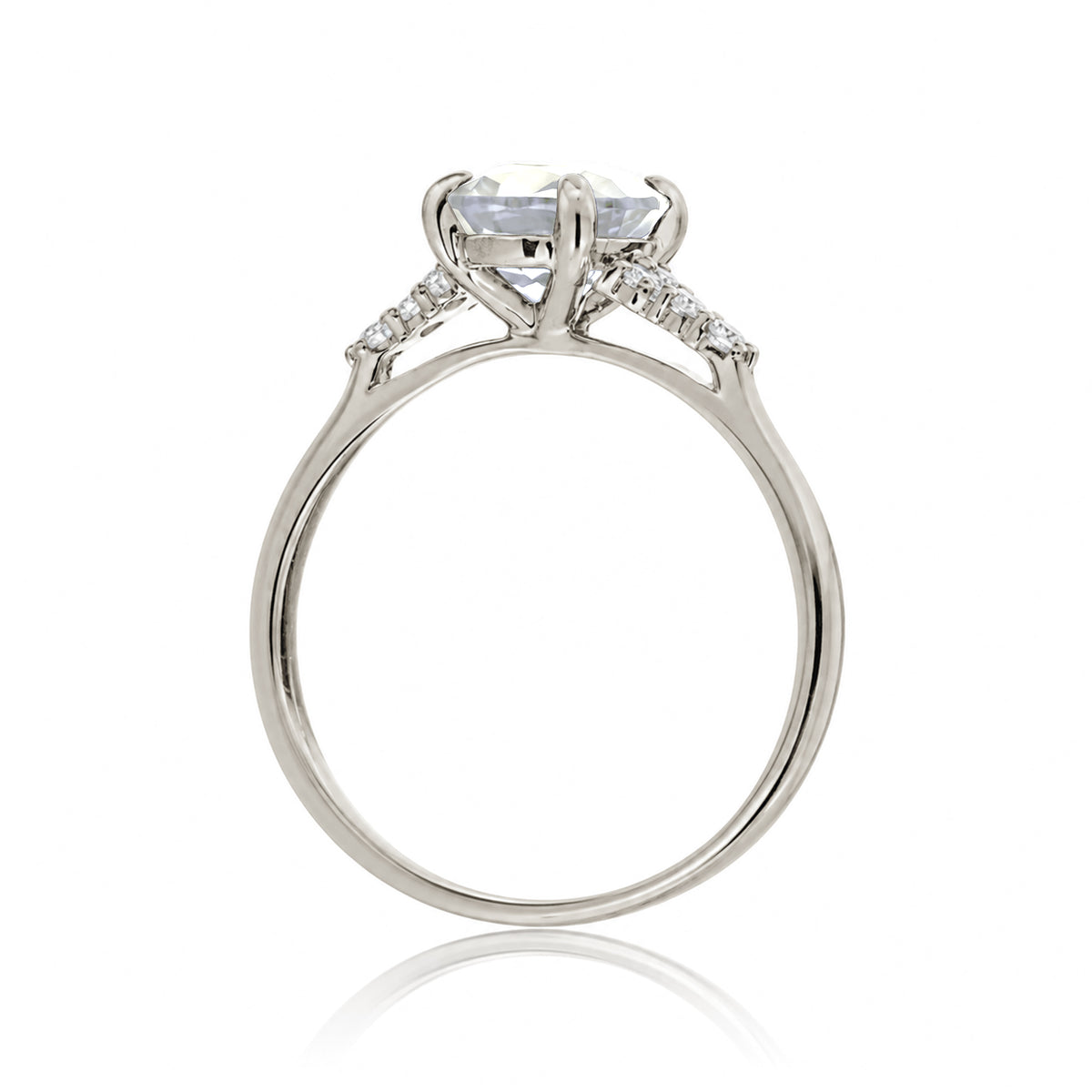 Round brilliant cut diamond engagement ring with rounded band in white gold