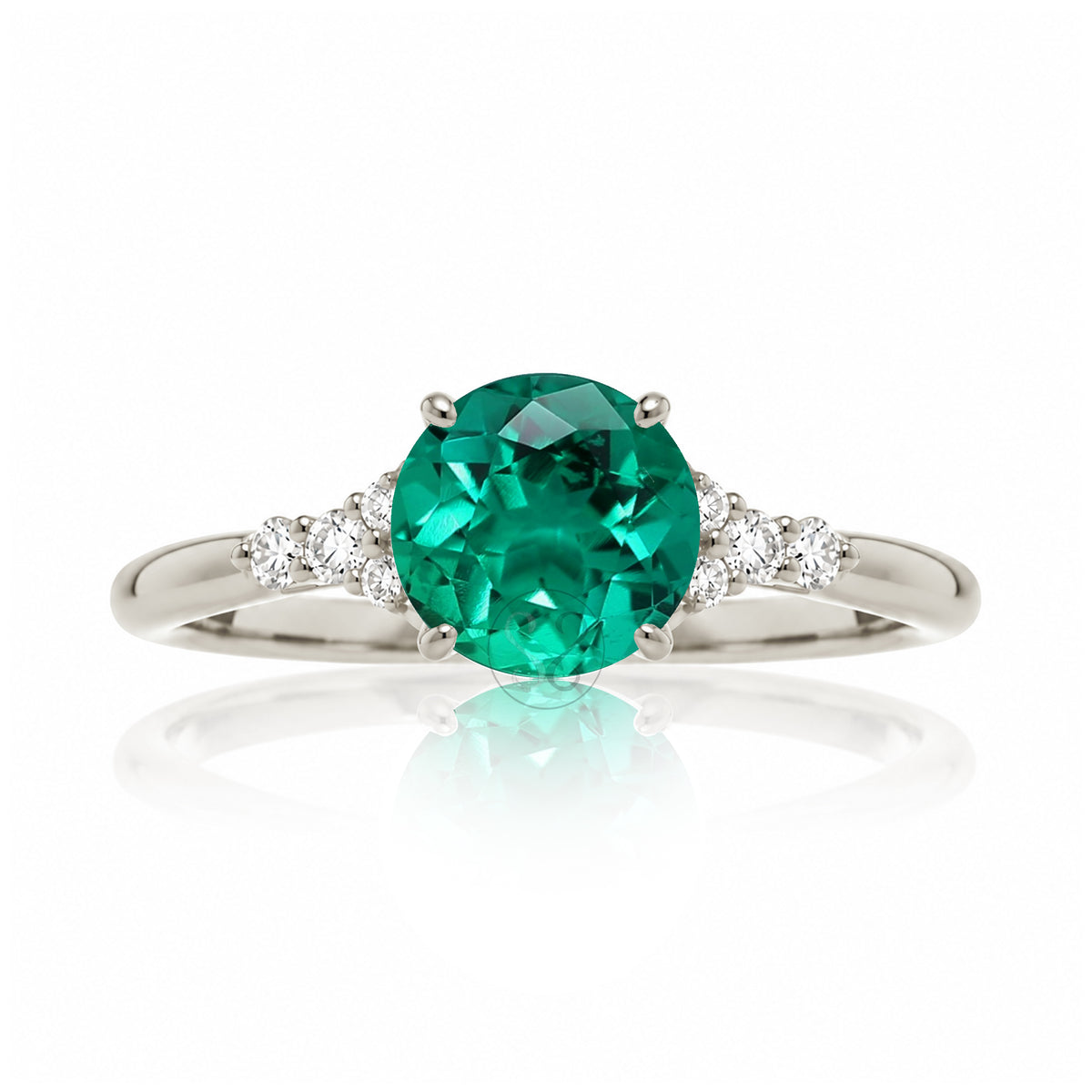 Round cut green emerald and diamond ring in white gold