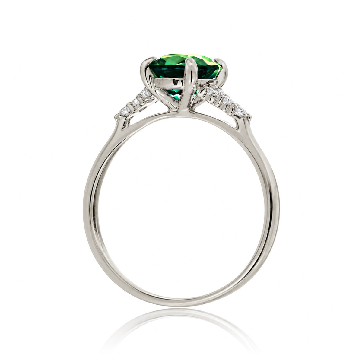 Round cut green emerald and diamond ring in white gold