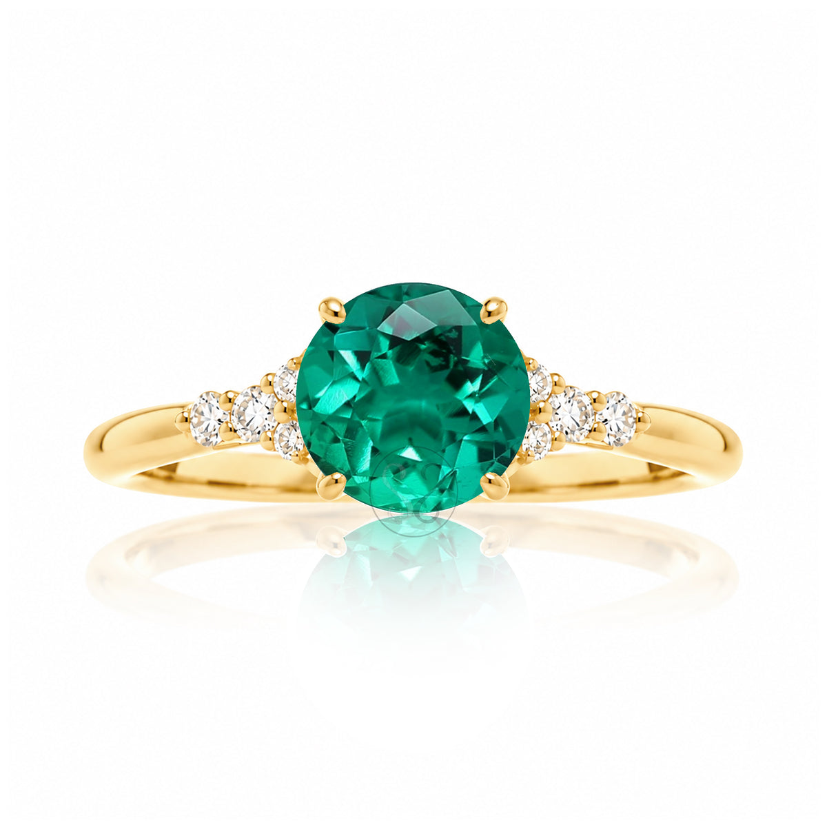 Round cut green emerald and diamond ring in yellow gold