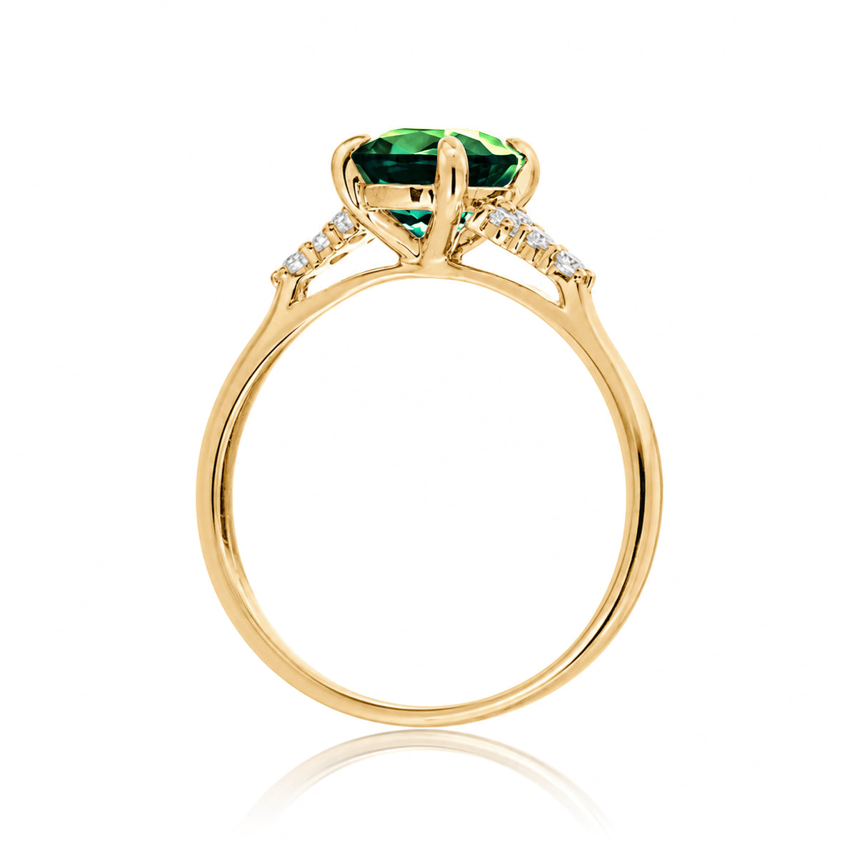 Round cut green emerald and diamond ring in yellow gold