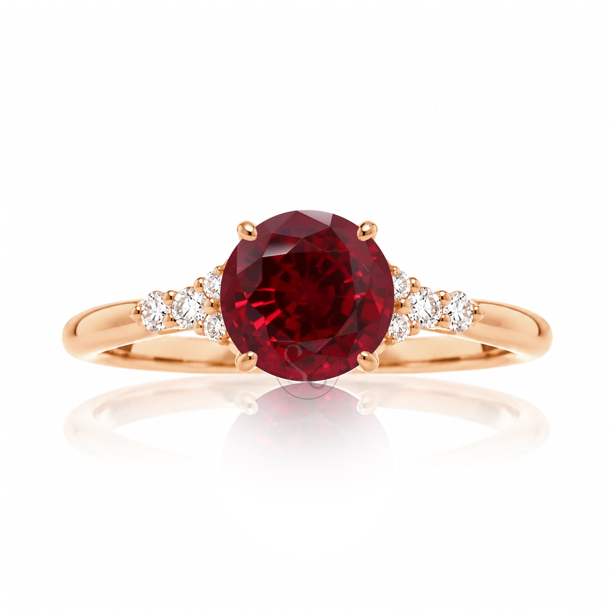 Round cut ruby three stone diamond ring in rose gold