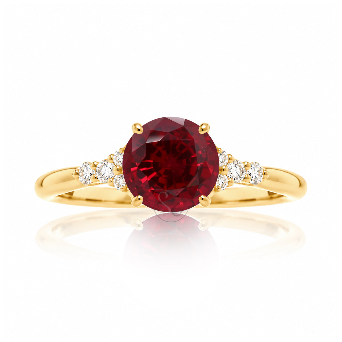 Round cut ruby three stone diamond ring in yellow gold