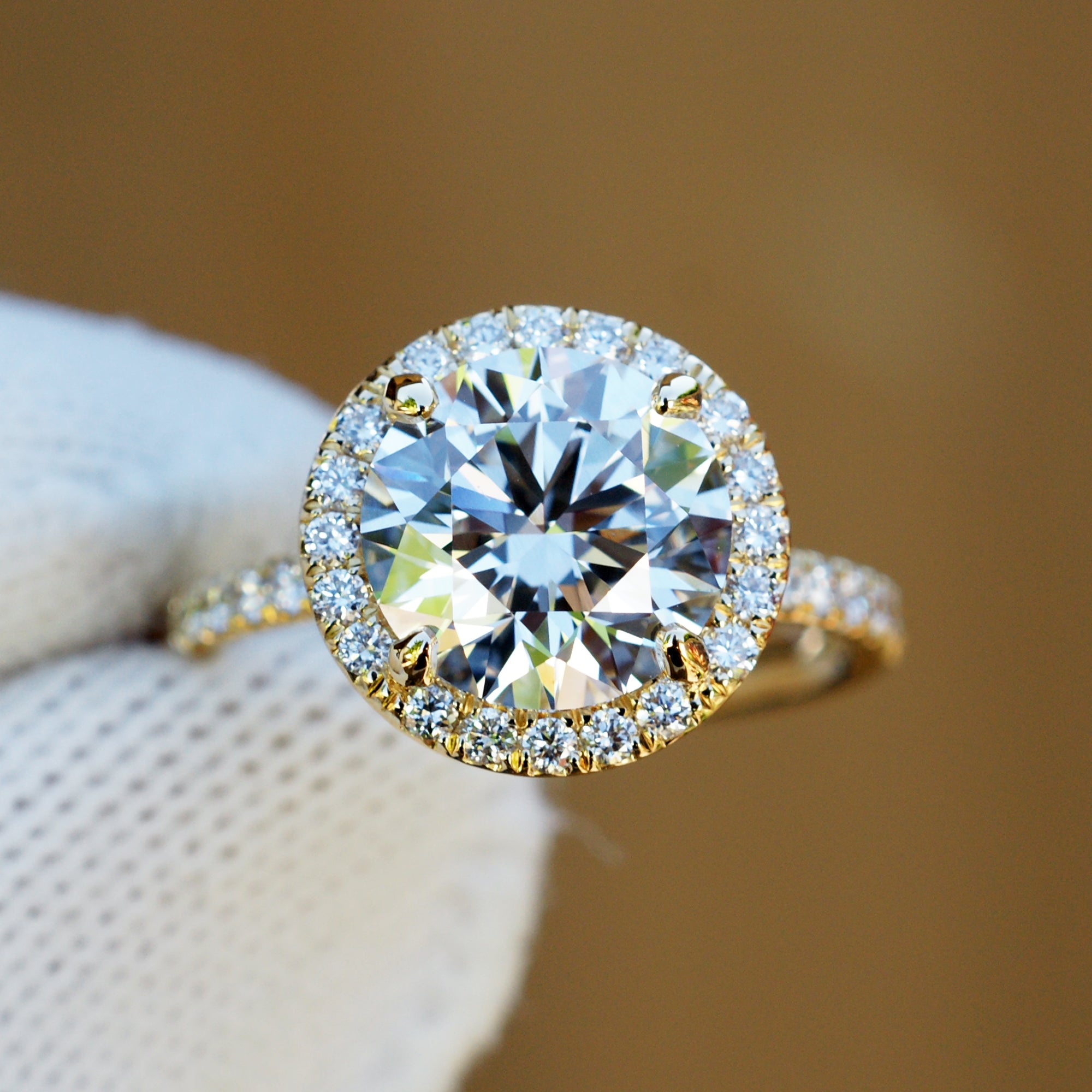 3 carat round plus diamond halo engagement ring in yellow gold