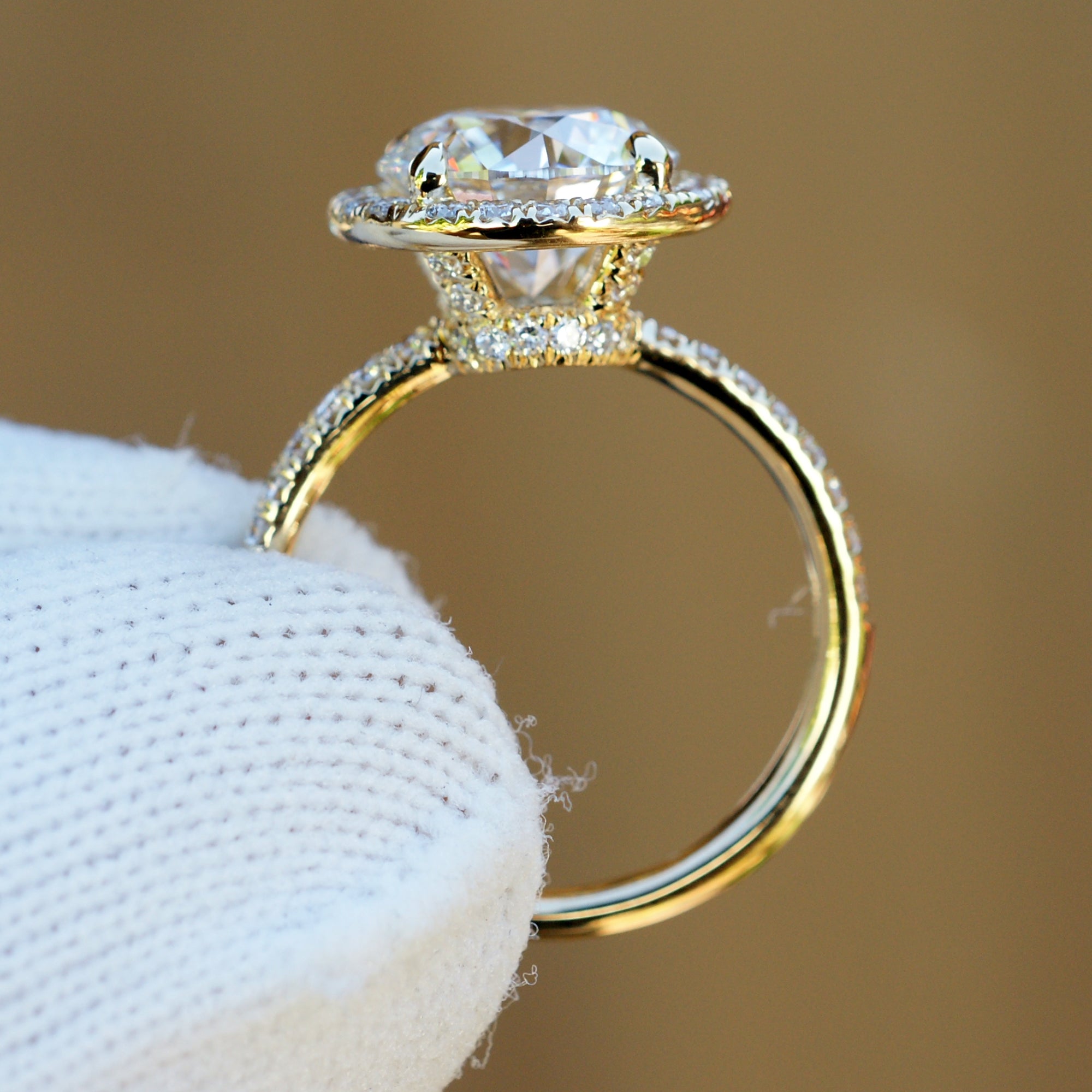 3 carat round plus diamond halo engagement ring in yellow gold