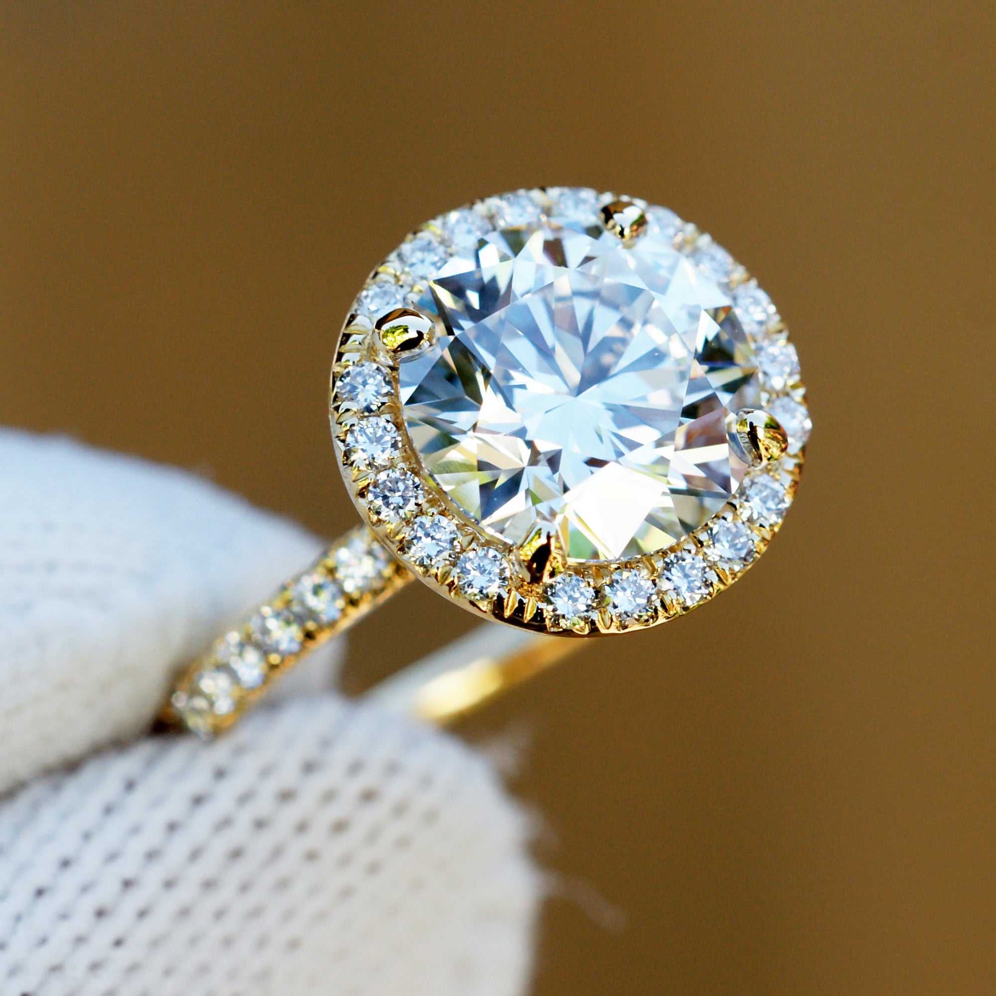 3 carat round plus diamond halo engagement ring in yellow gold
