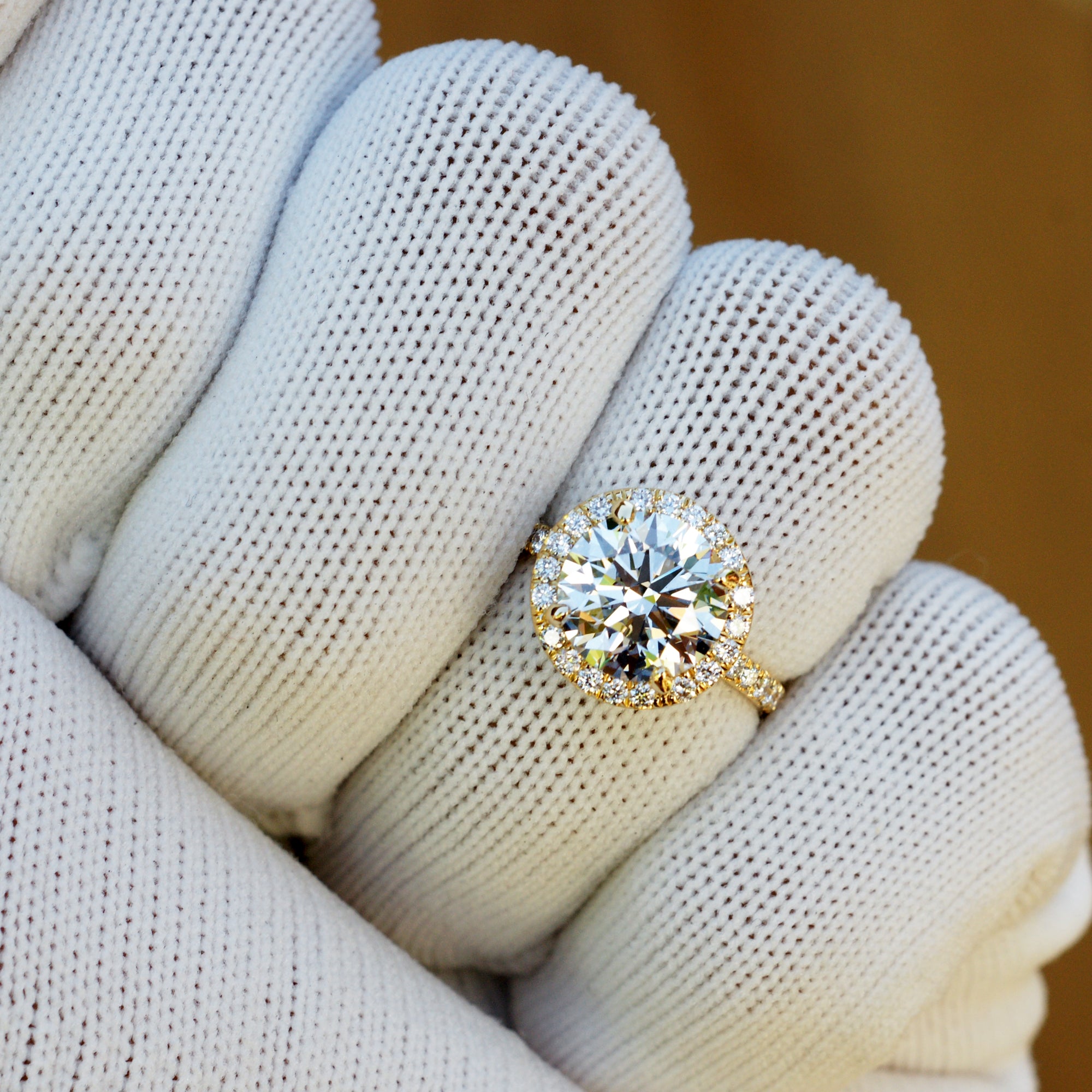 3 carat round plus diamond halo engagement ring in yellow gold