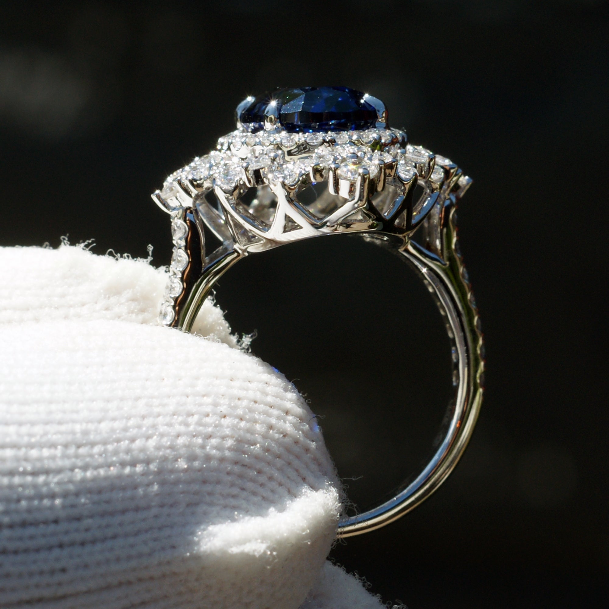 Kate's oval blue sapphire ring with diamond halo in white gold