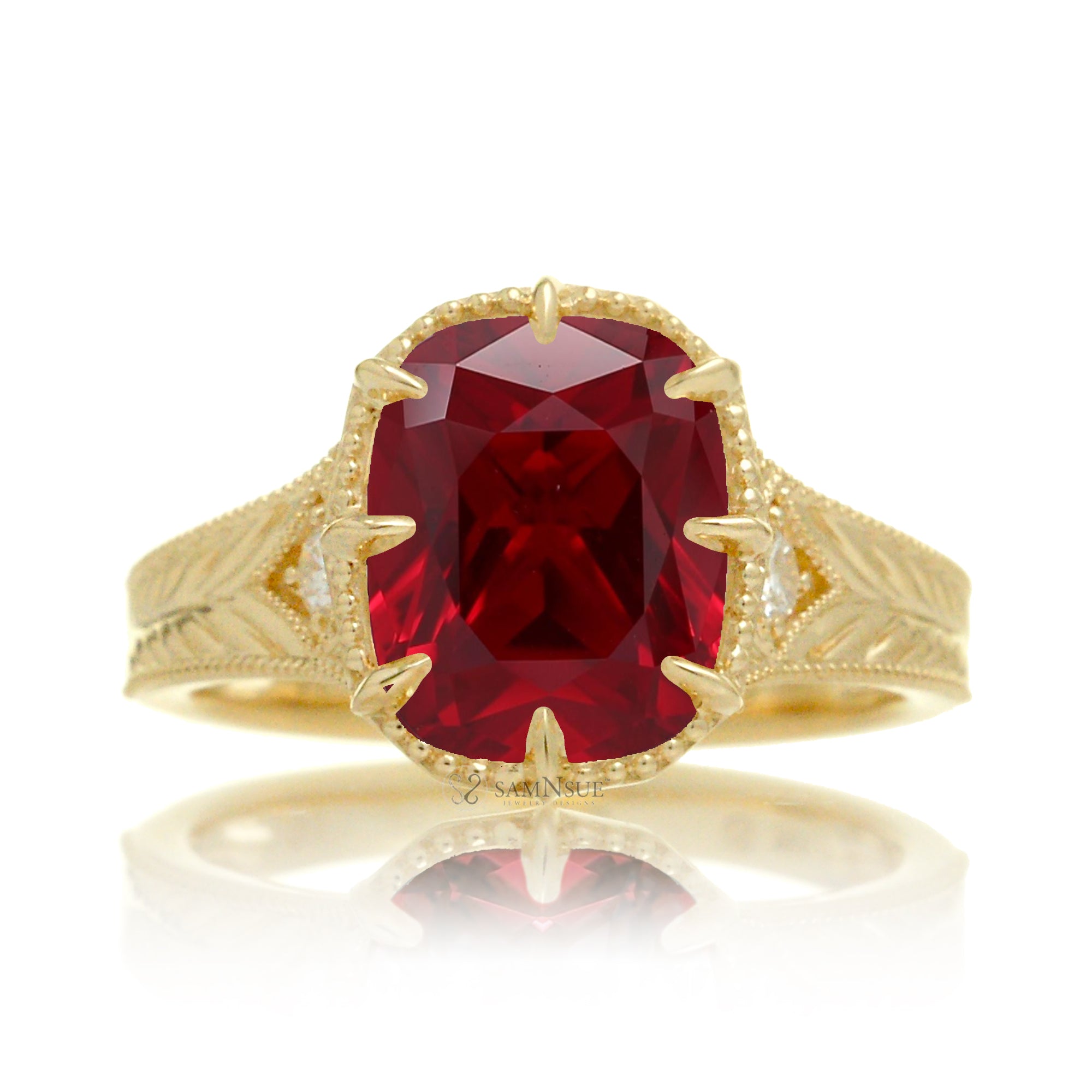 An elegant cushion cut ruby takes center stage in this vintage-style ring. The rich designed yellow gold band, adorned with delicate detailing, highlights the diamond’s fire and evokes a sense of classic, enduring romance.