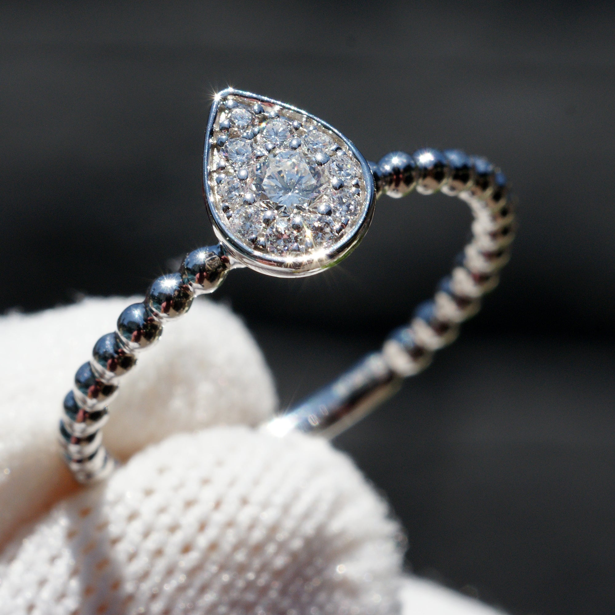 Pear cluster diamond ring with beaded band in white gold