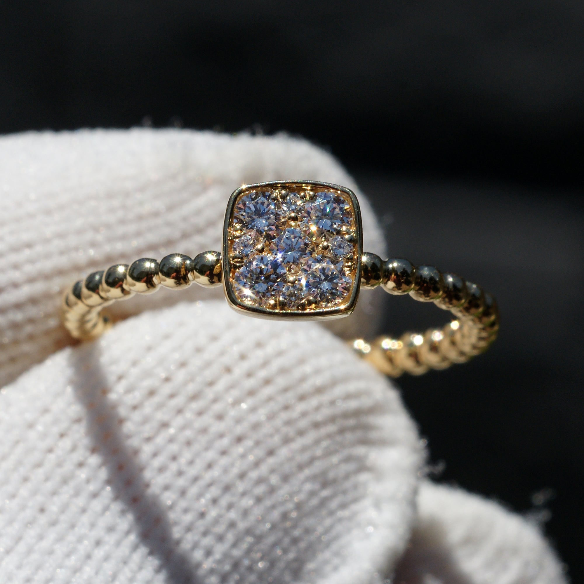 Square cushion cluster diamond solitaire with beaded yellow gold band