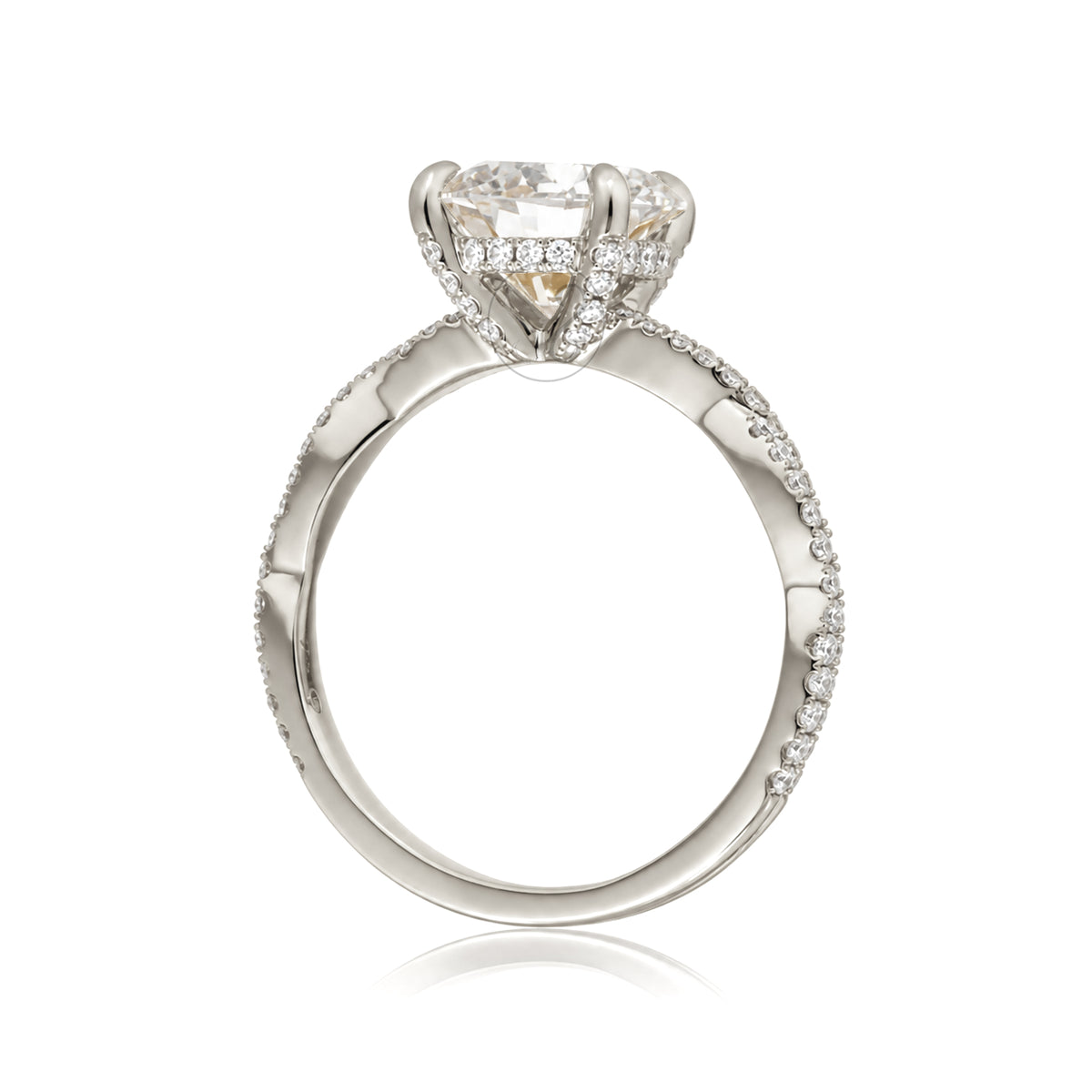 Profile view The Seraphina round diamond engagement ring in white gold with twisted pavé diamond band and four-prong setting