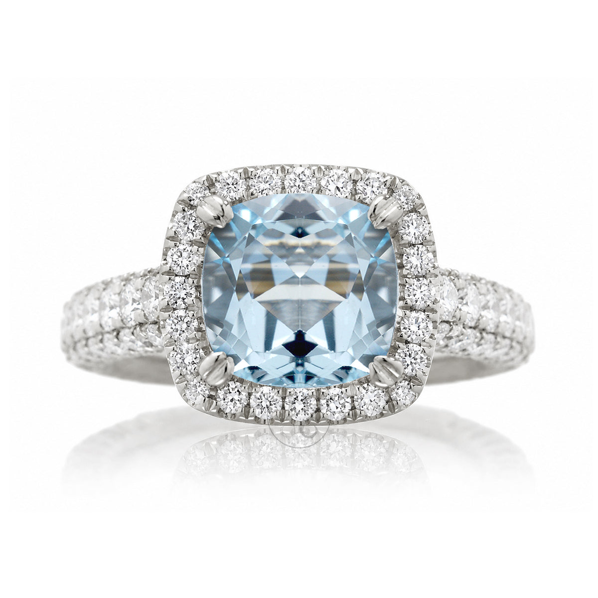 Cushion-cut aquamarine engagement ring in white gold with diamond halo and pavé diamond shoulders The Tamara
