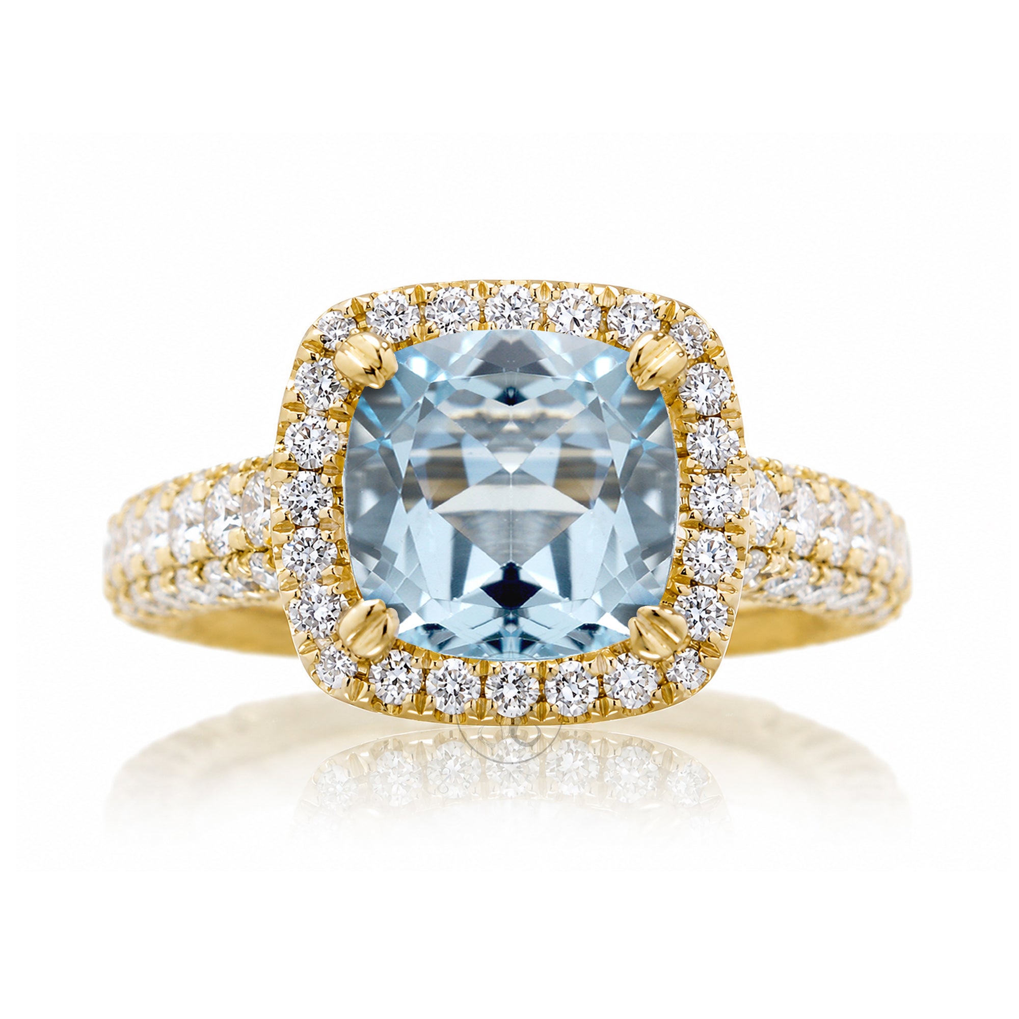 Cushion-cut aquamarine engagement ring in yellow gold with diamond halo and pavé diamond shoulders The Tamara