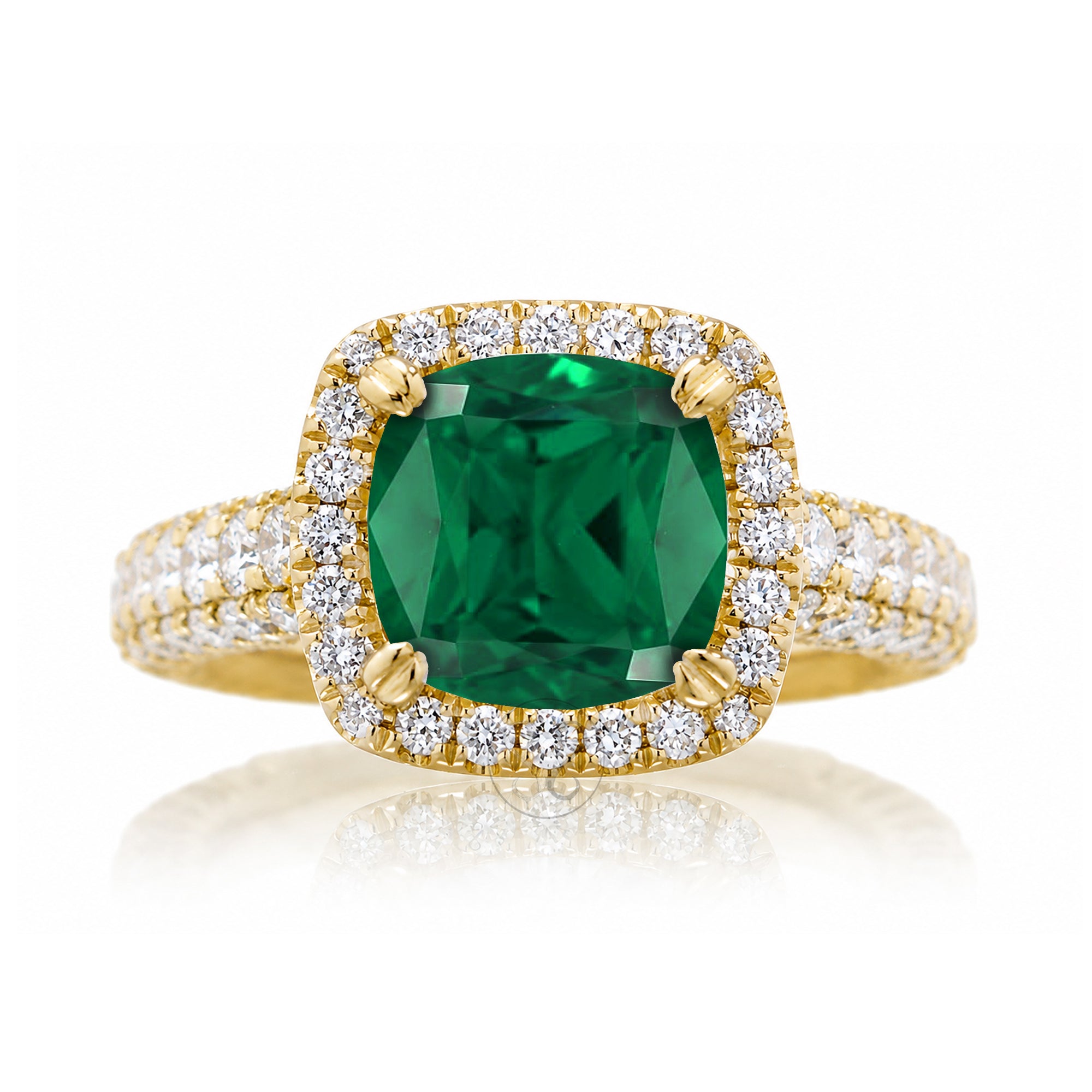 Cushion-cut emerald engagement ring in yellow gold with diamond halo and pavé diamond shoulders The Tamara