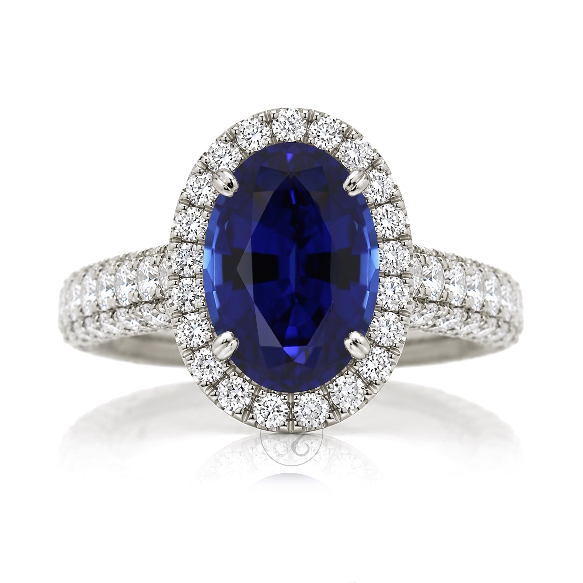 Oval blue sapphire diamond halo with three dimensional dome band in white gold