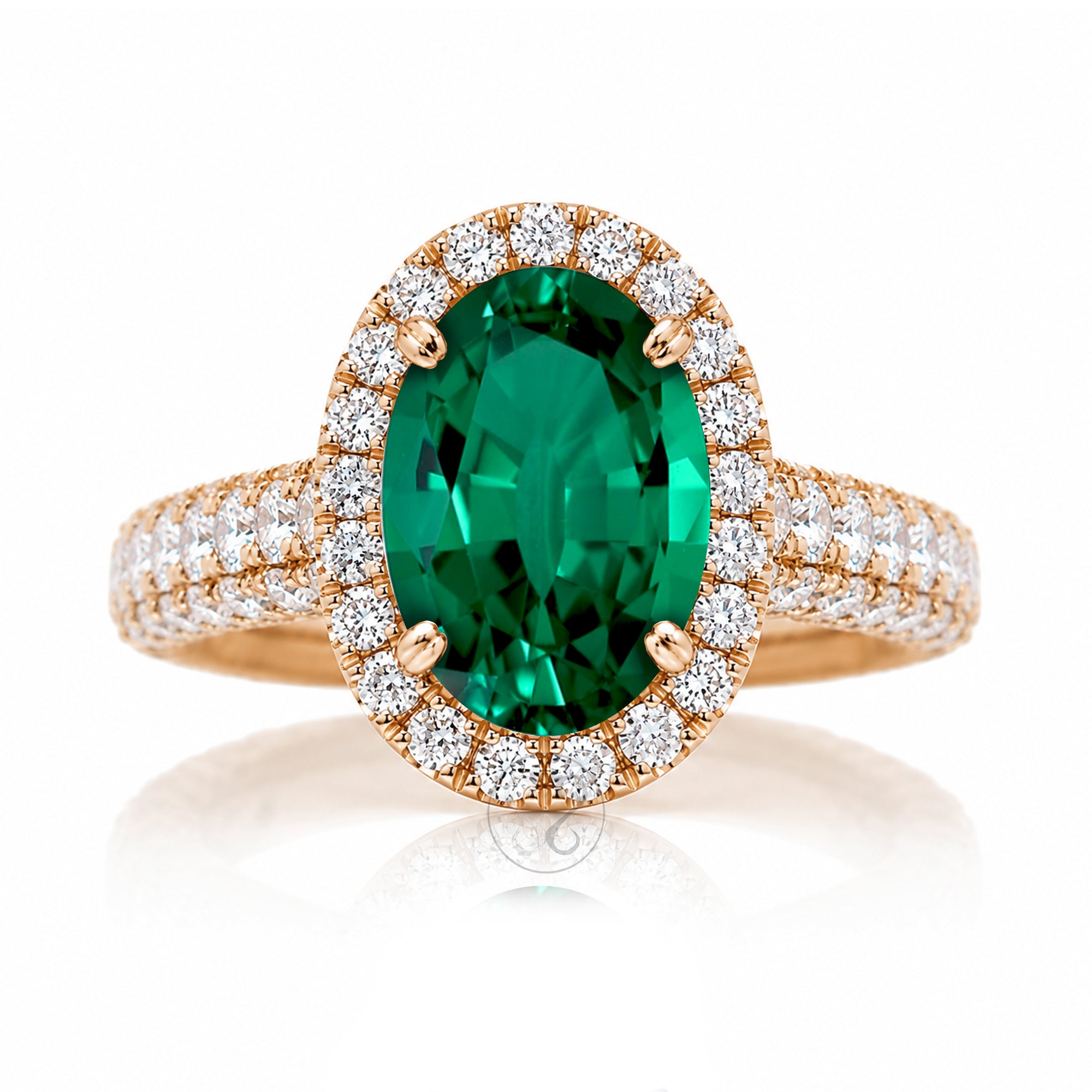 Oval-cut emerald engagement ring in rose gold with diamond halo and pavé diamond shoulders The Tamara