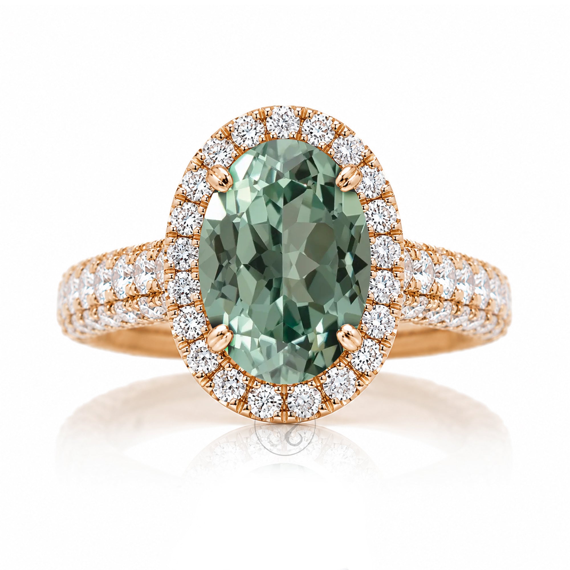 Oval-cut green sapphire engagement ring in rose gold with diamond halo and pavé diamond shoulders