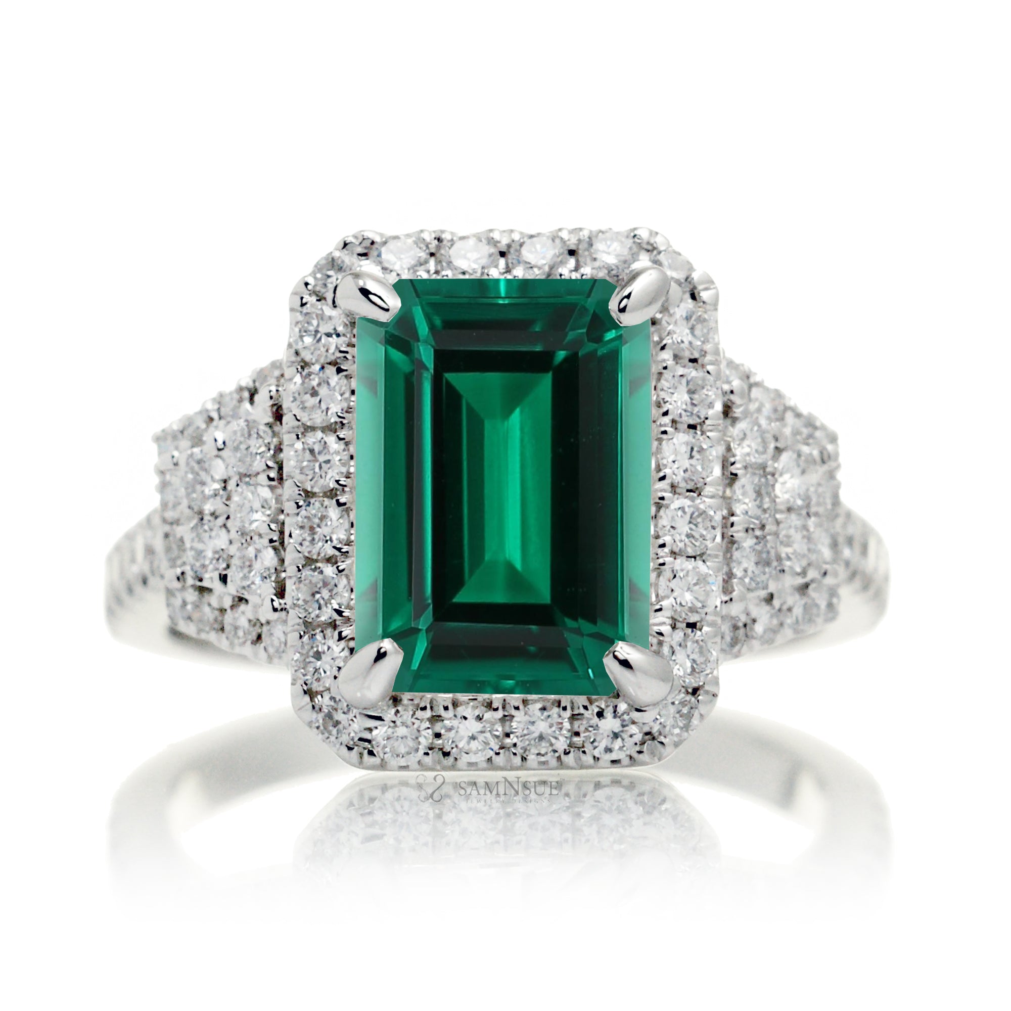 Emerald cut green beryl diamond halo and trapezoid three stone ring white gold