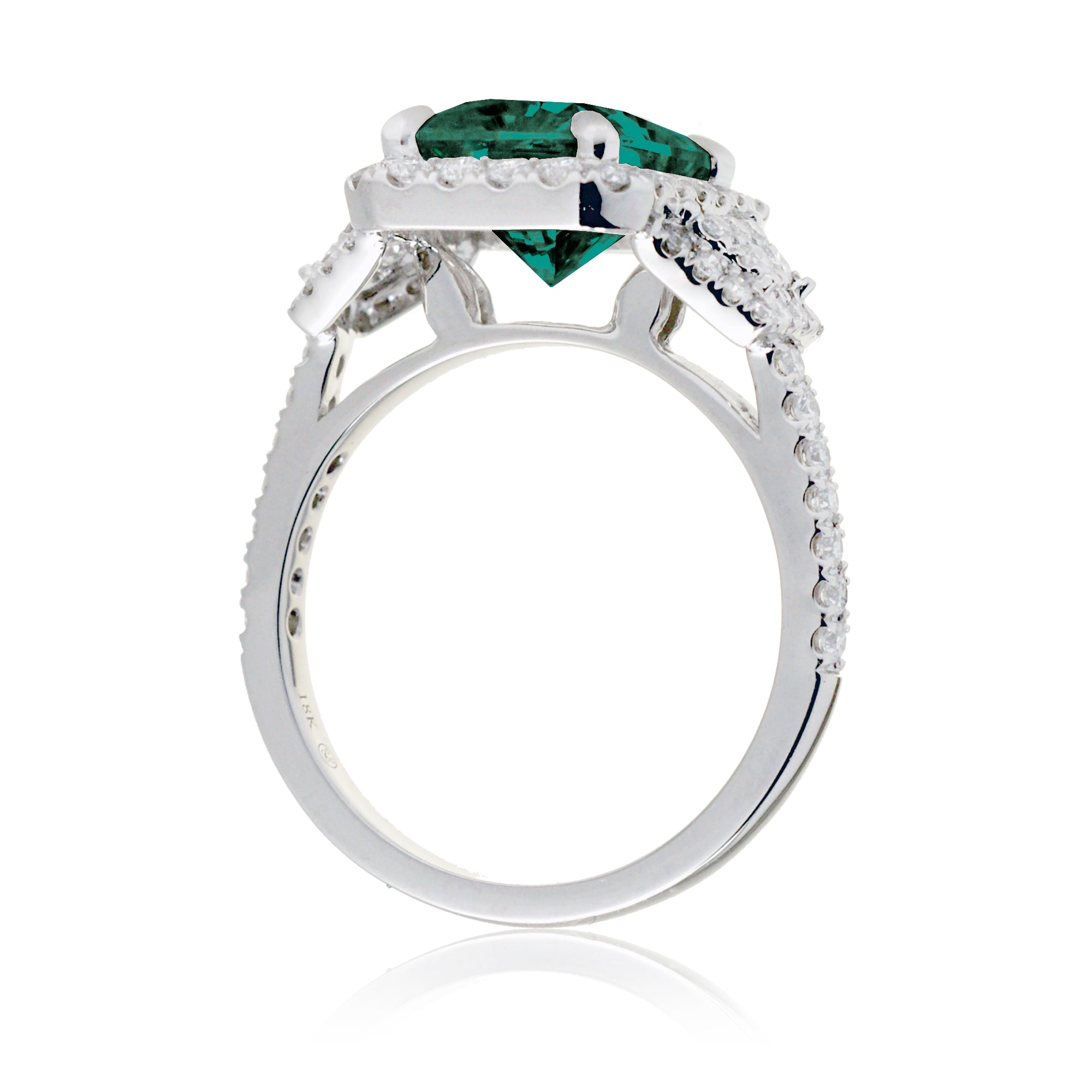 Emerald cut green beryl diamond halo and trapezoid three stone ring white gold