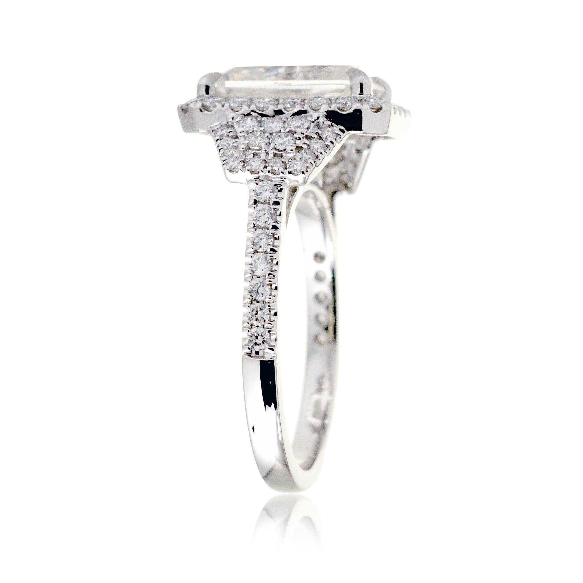 Emerald cut Moissanite diamond halo and trapezoid three stone ring white gold