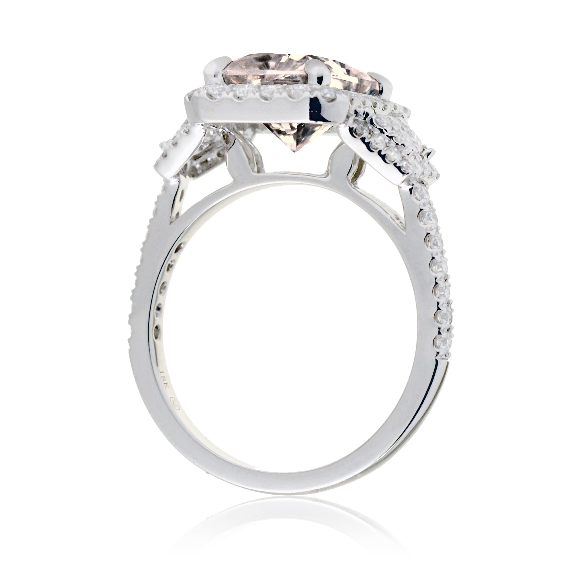 Emerald cut morganite diamond halo and trapezoid three stone ring white gold
