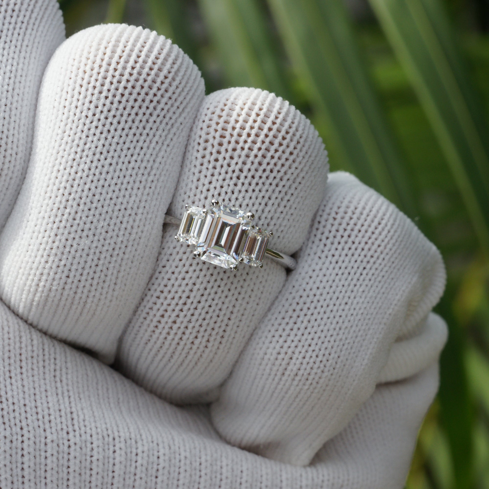 Past present future style moissanite ring in white gold with emerald cut