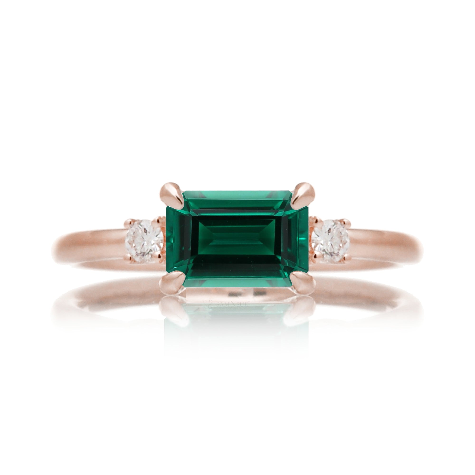 Three Stone side way setting emerald step cut rose gold ring