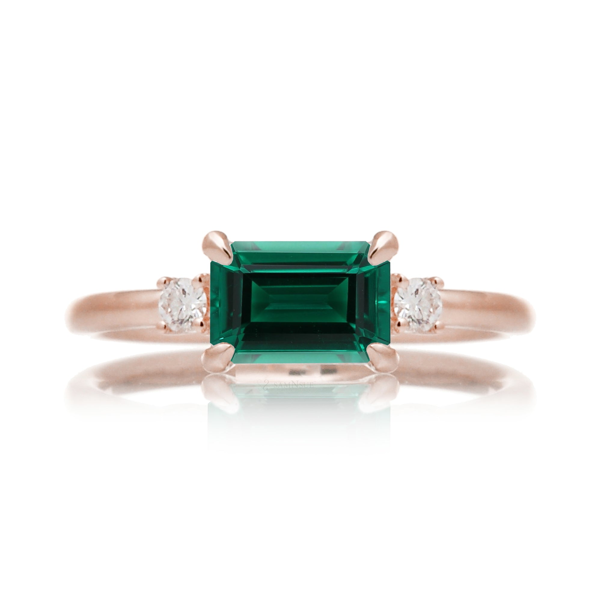 Three Stone side way setting emerald step cut rose gold ring