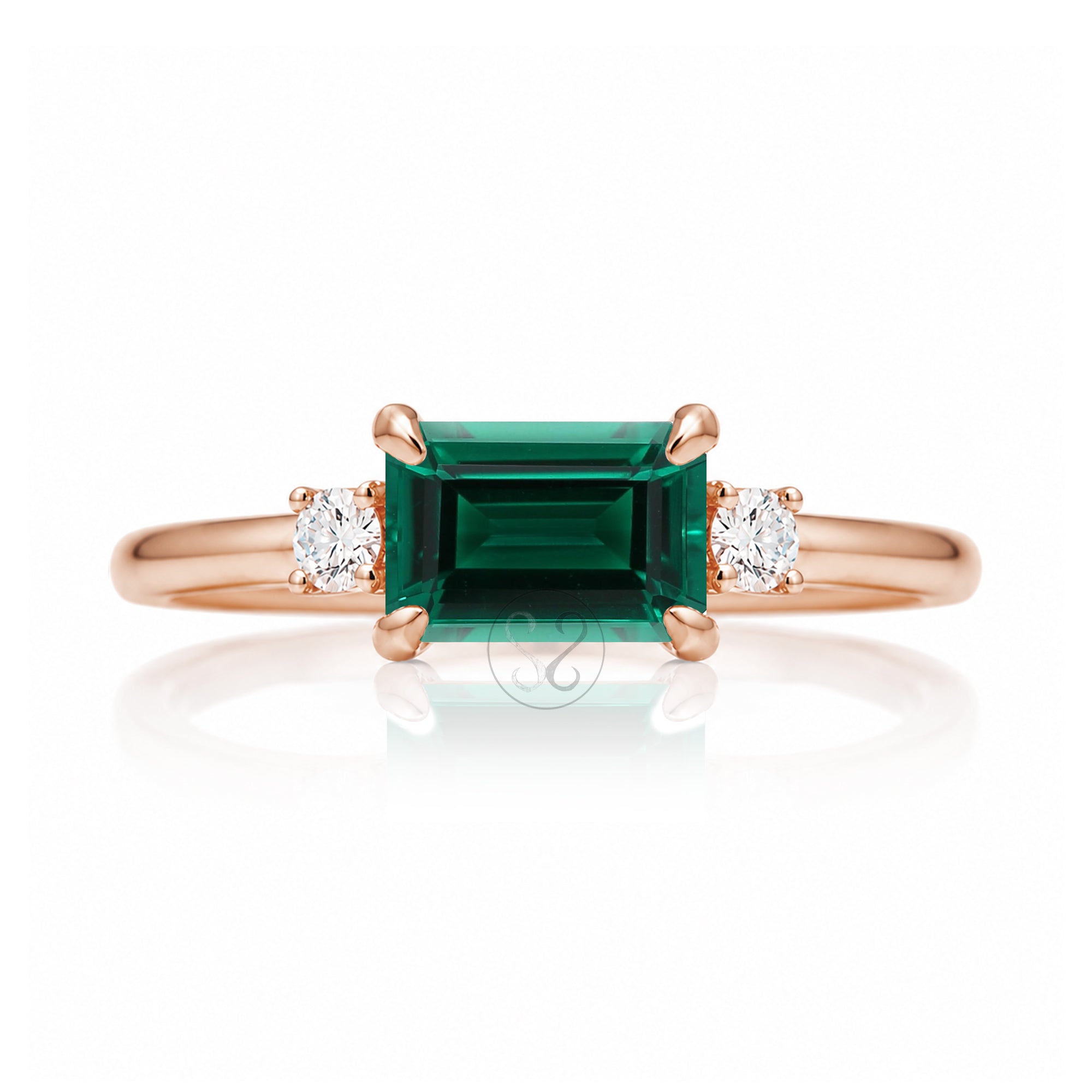 Three Stone side way setting emerald step cut rose gold ring