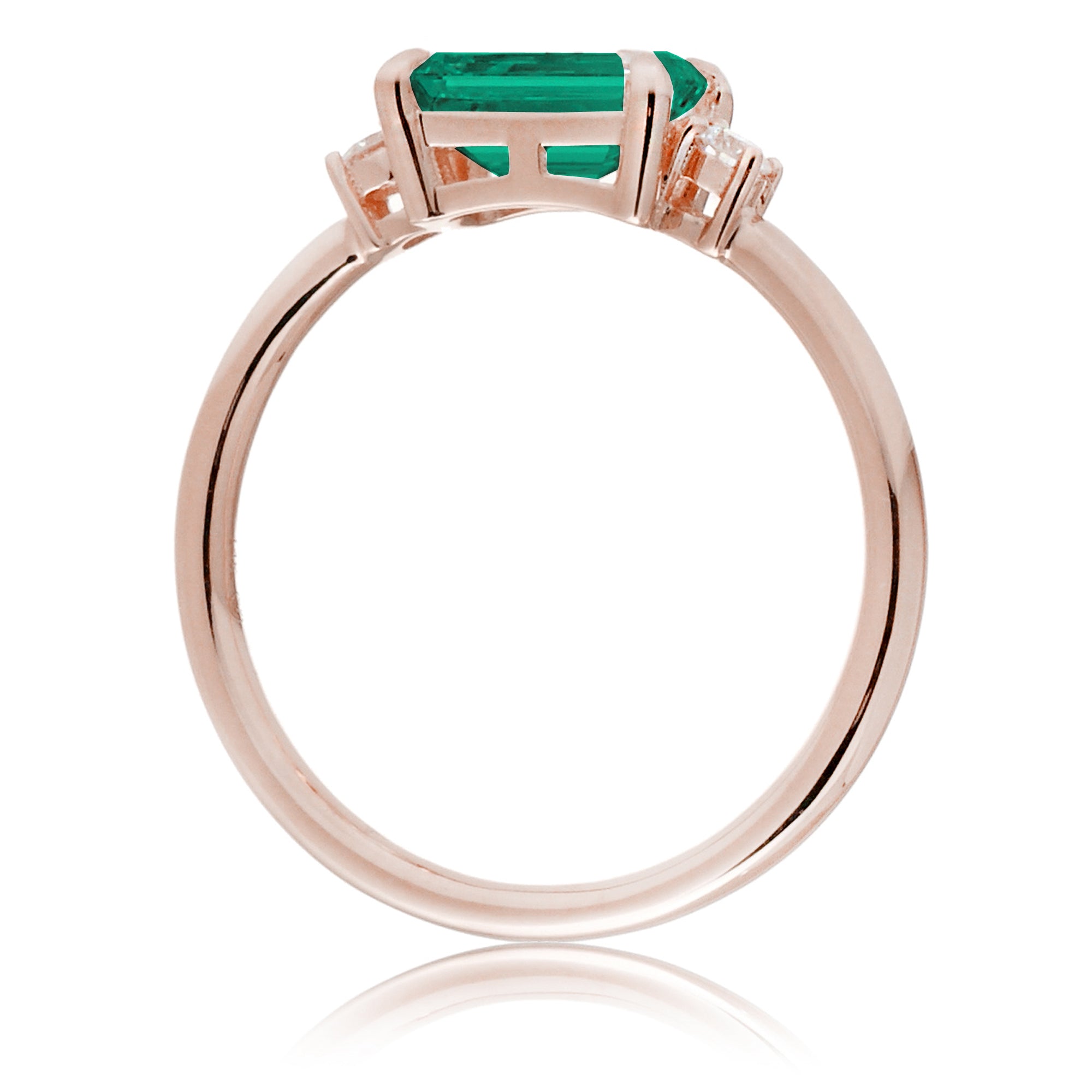 Three Stone side way setting emerald step cut rose gold ring