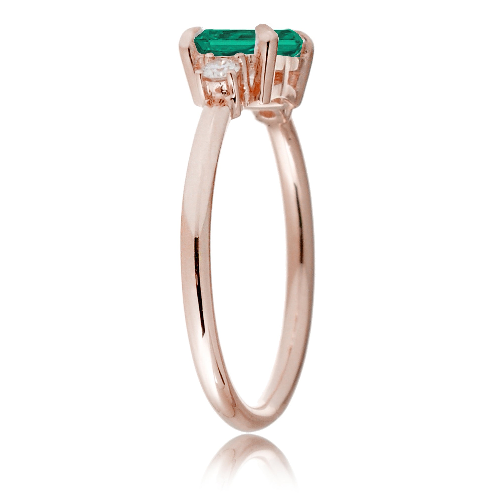 Three Stone side way setting emerald step cut rose gold ring