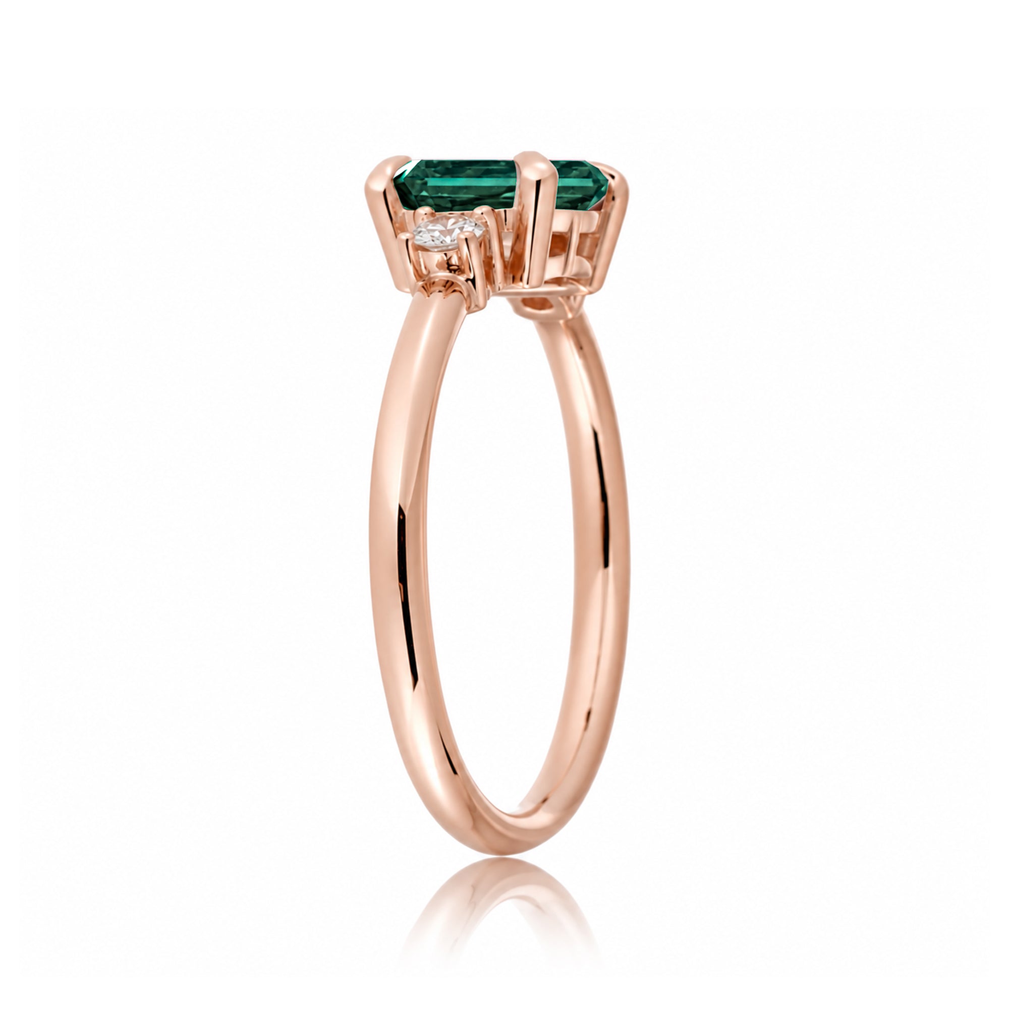 Three Stone side way setting emerald step cut rose gold ring