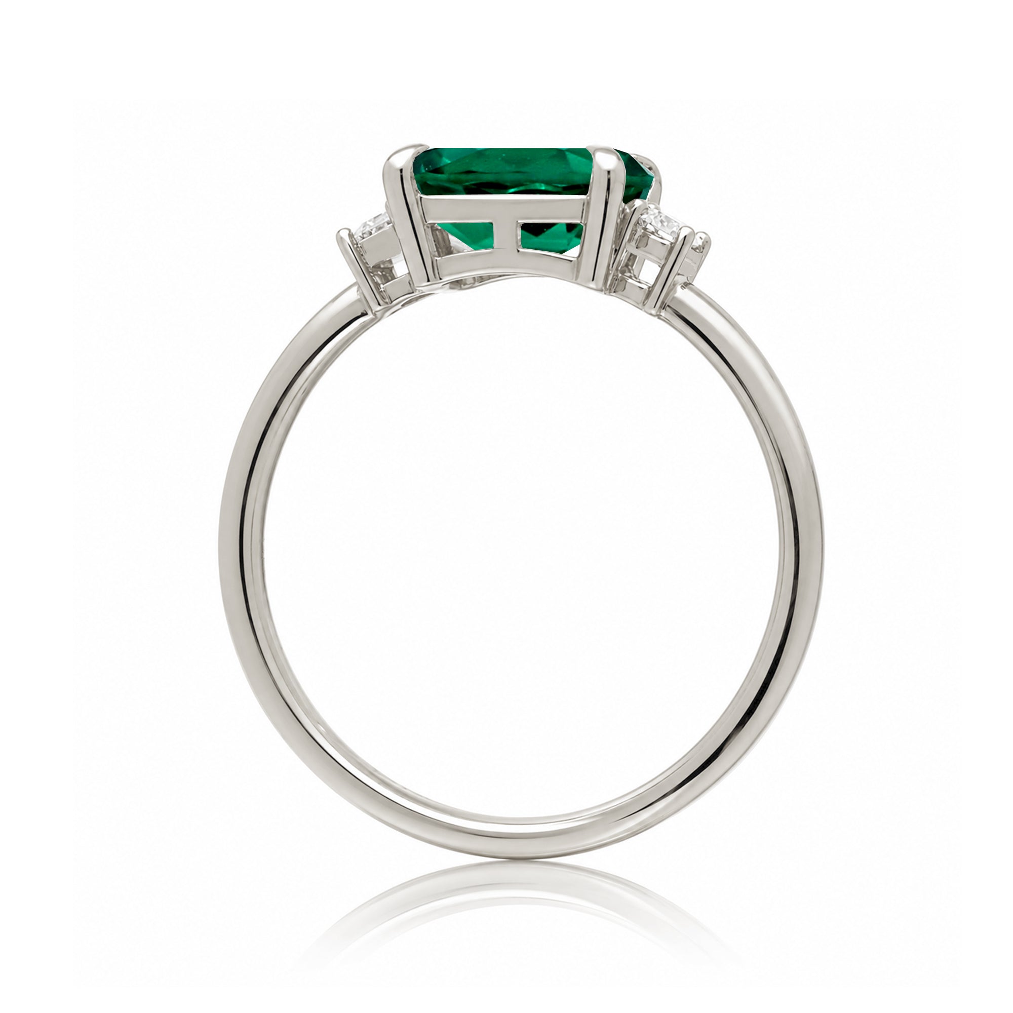 Three Stone side way setting emerald step cut white gold ring
