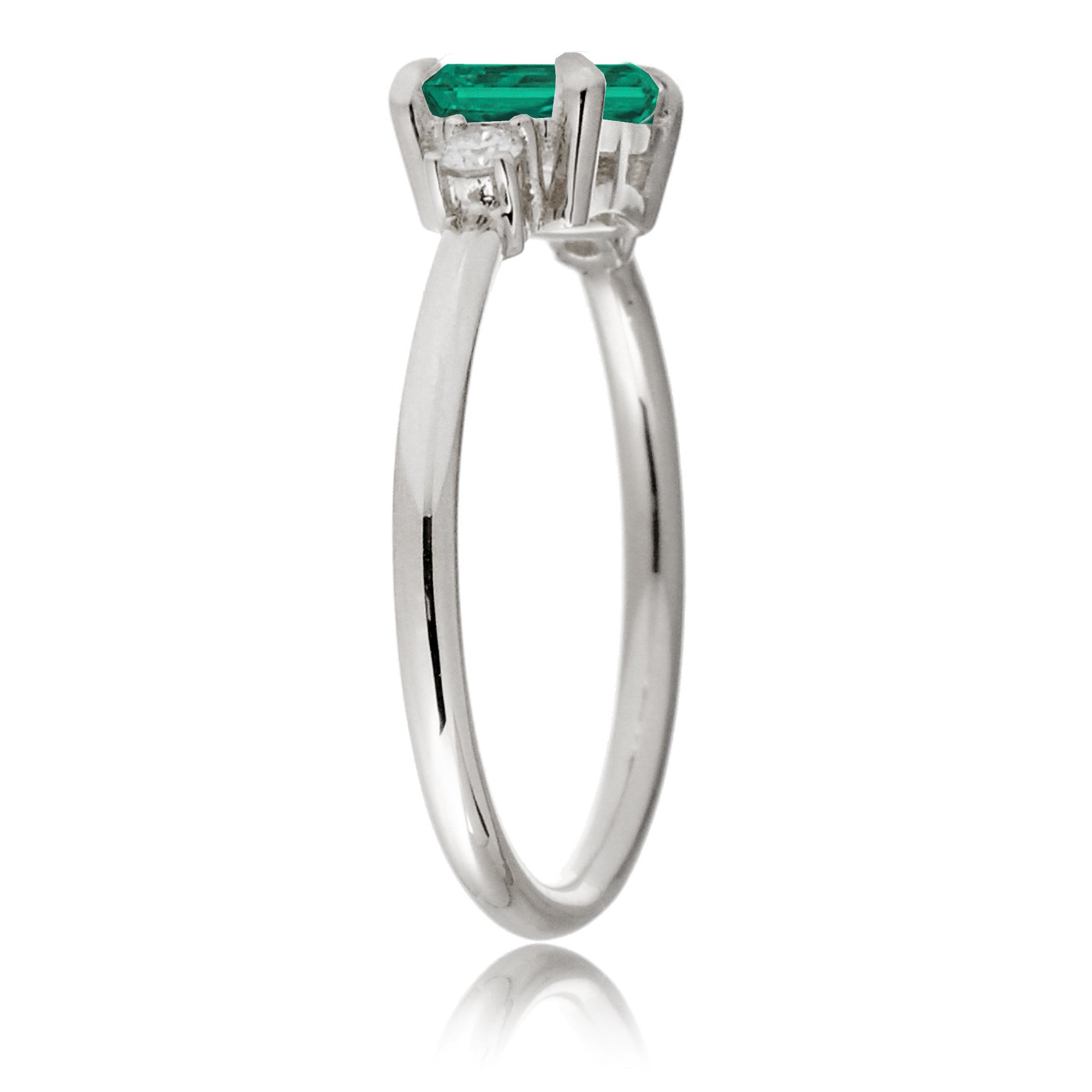 Three Stone side way setting emerald step cut white gold ring