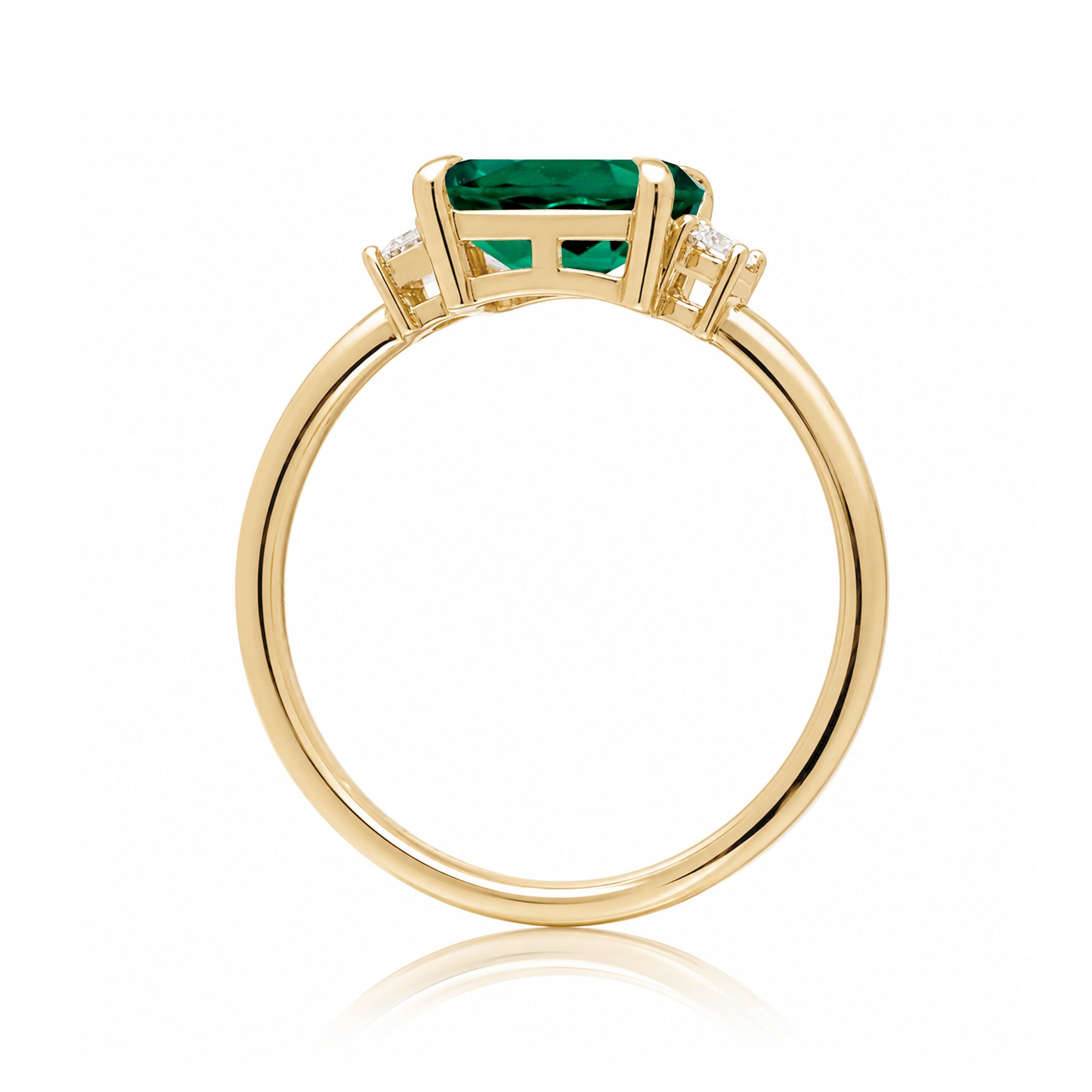 Three Stone side way setting emerald step cut yellow gold ring