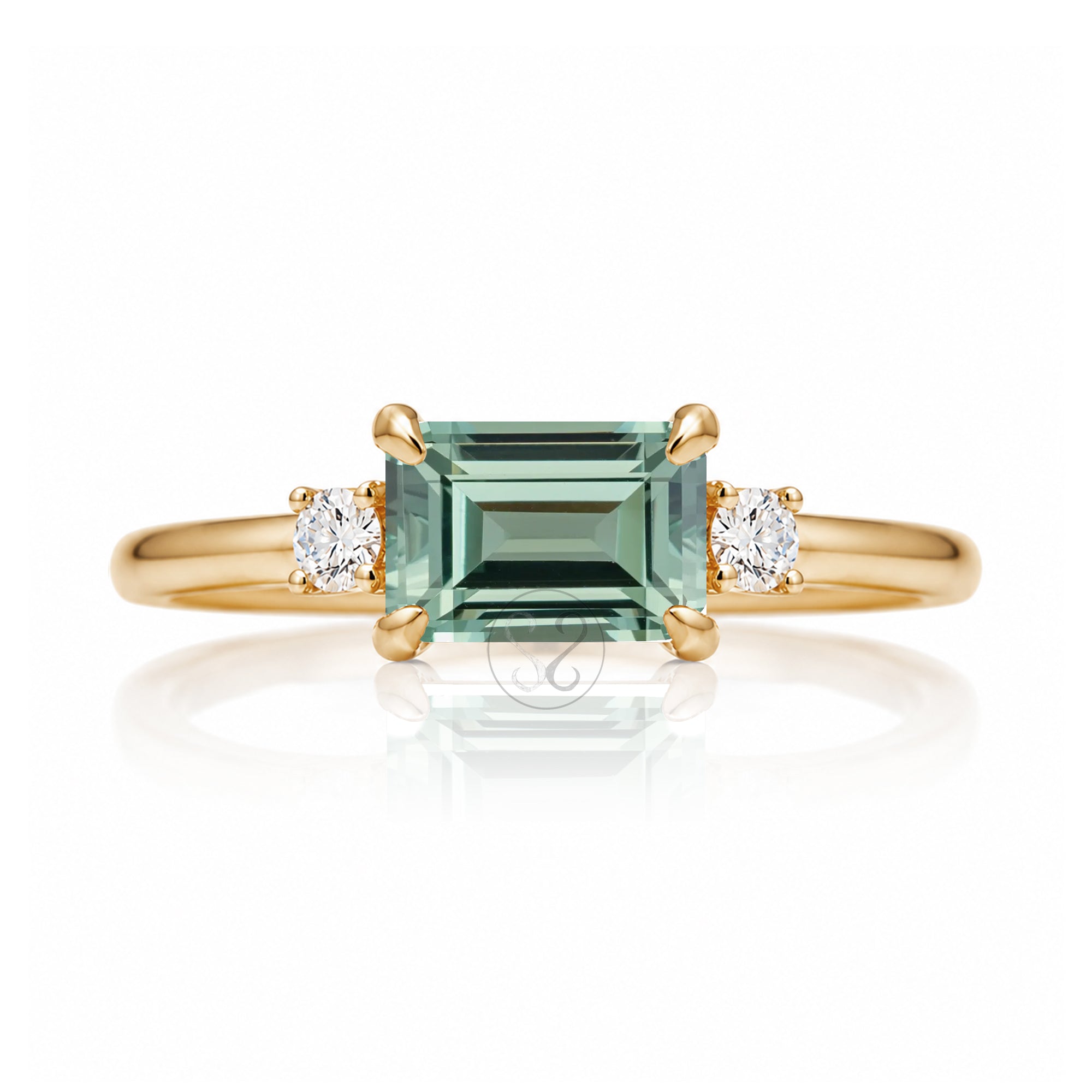 Emerald cut green sapphire three stone ring the Lena yellow gold