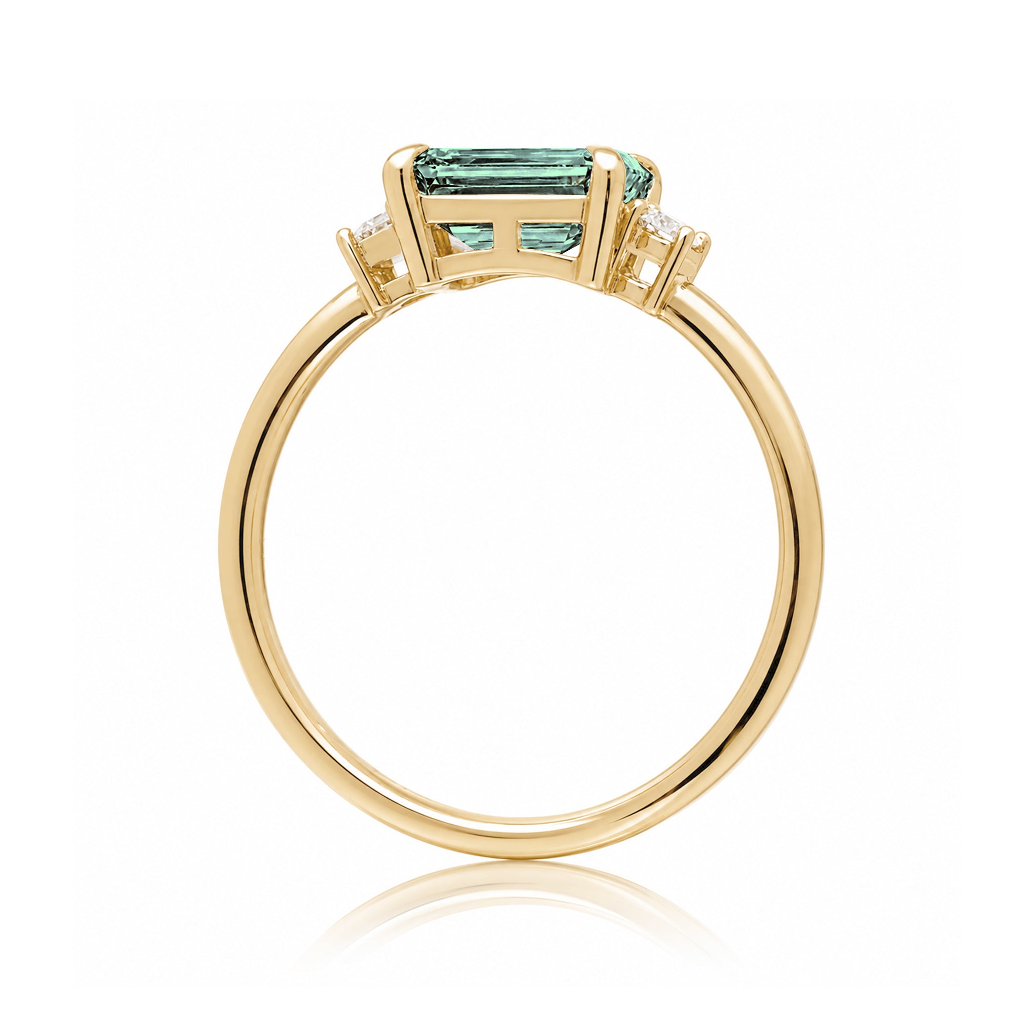 Emerald cut green sapphire three stone ring the Lena yellow gold