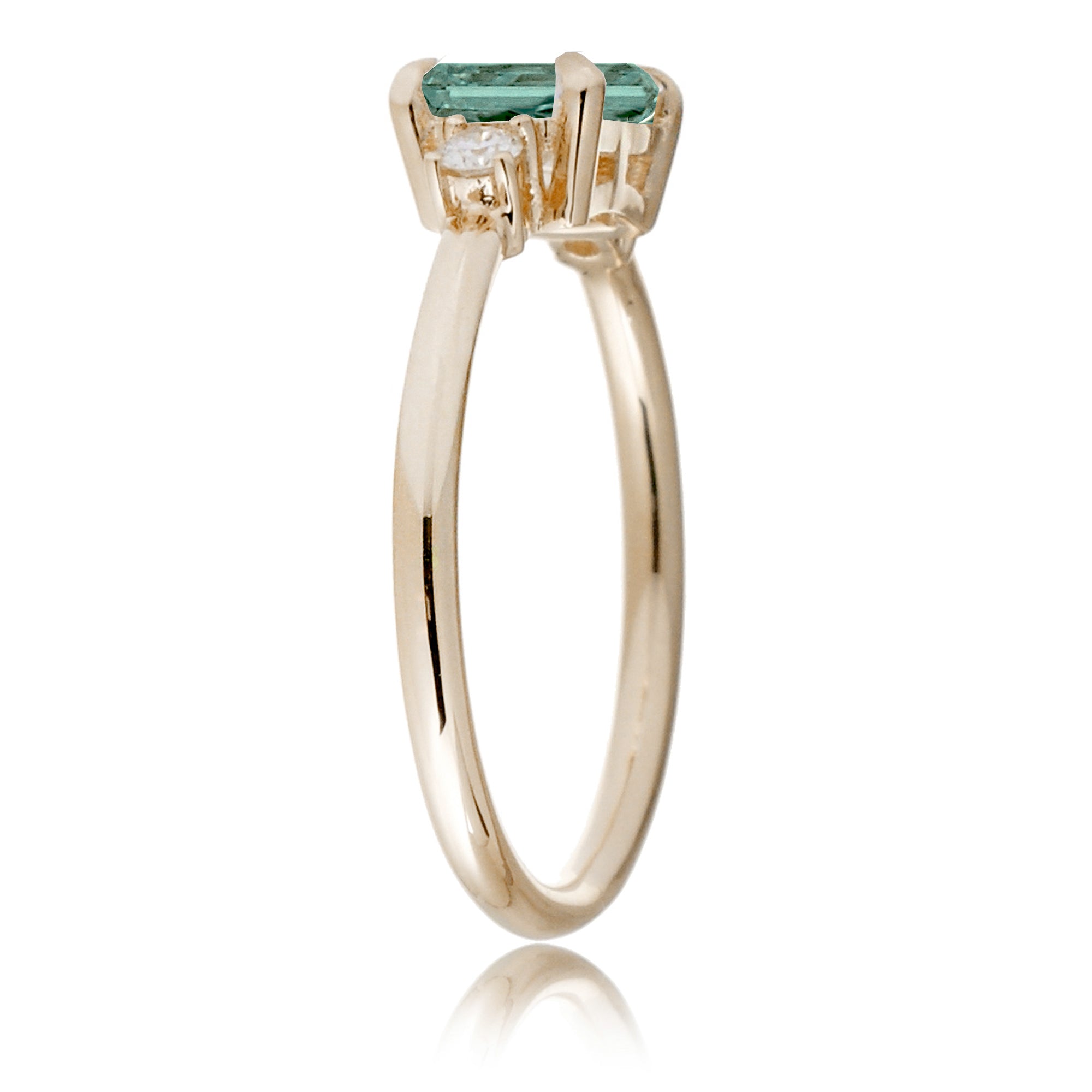 Emerald cut green sapphire three stone ring the Lena yellow gold