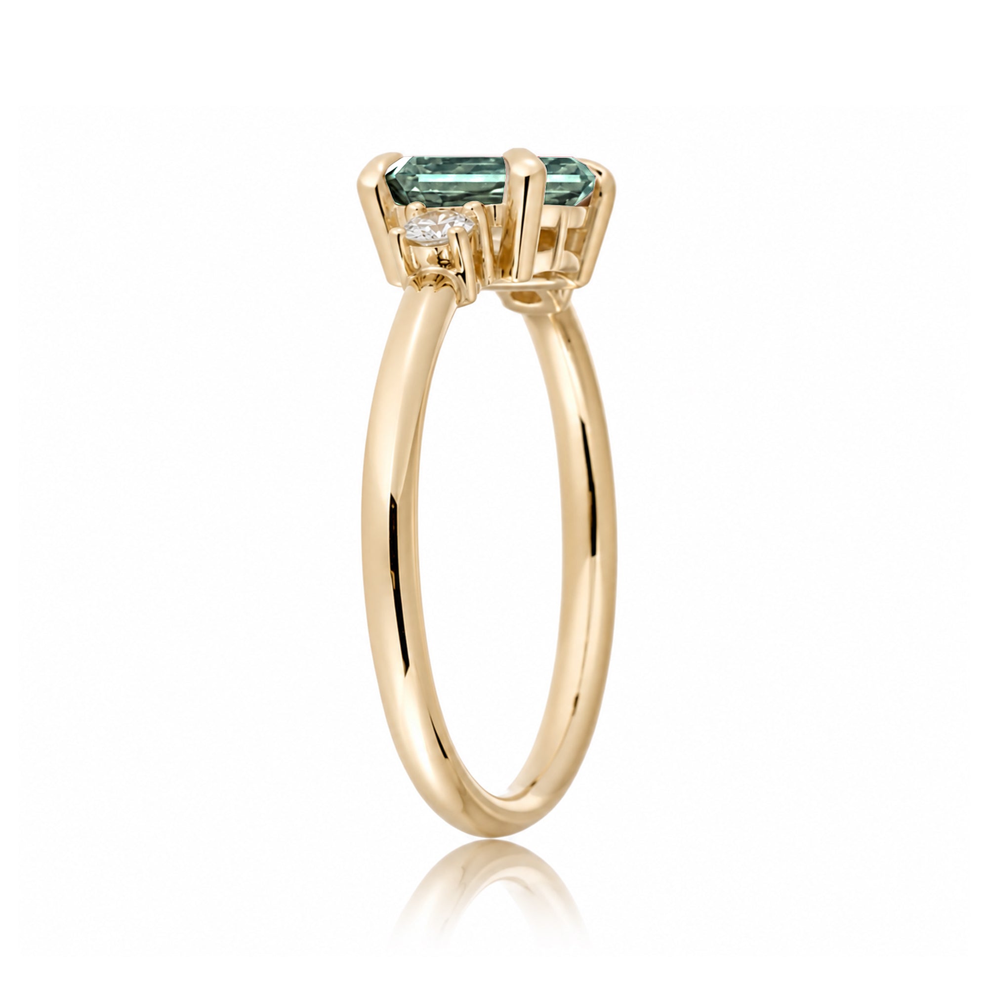 Emerald cut green sapphire three stone ring the Lena yellow gold