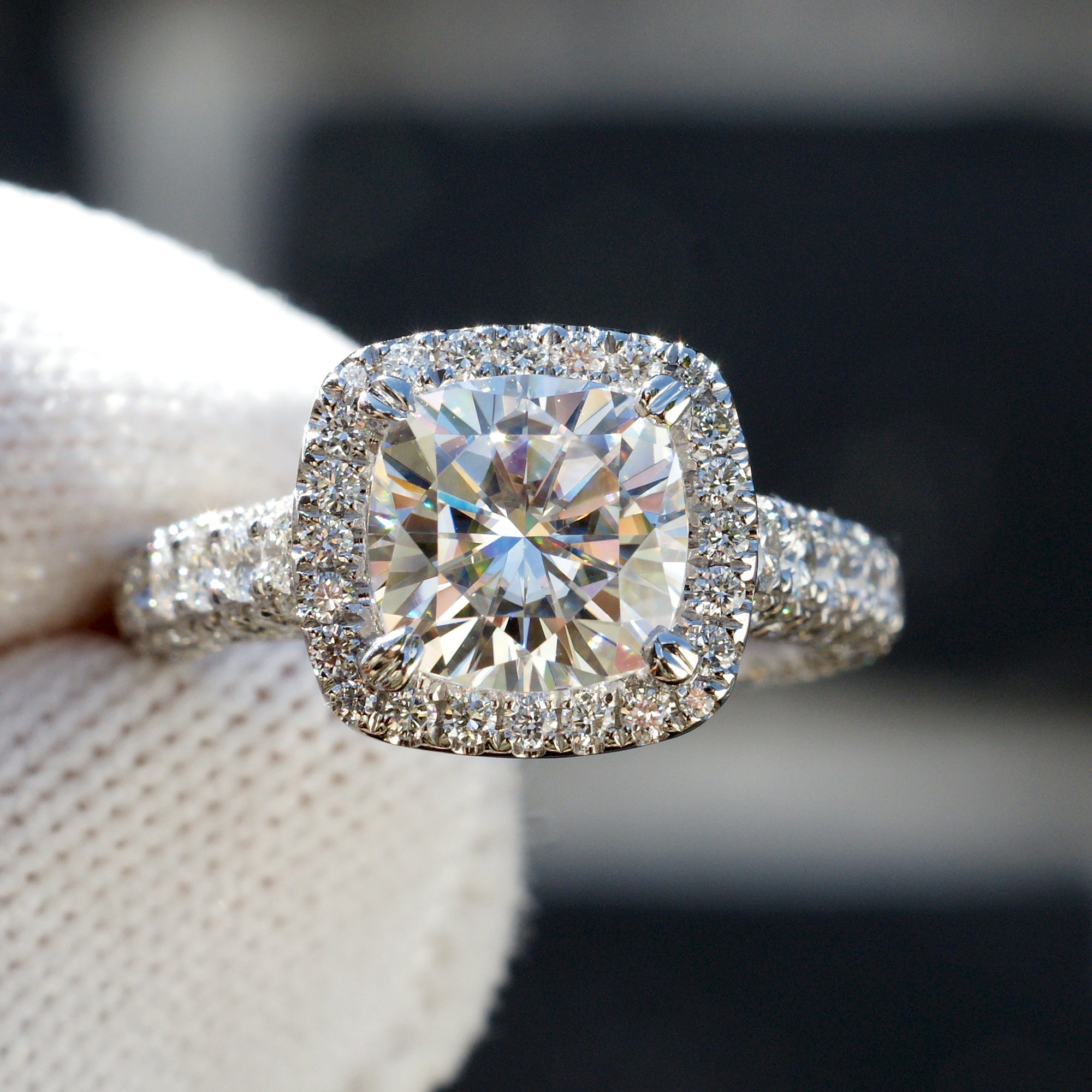 Cushion cut moissanite and diamond halo total drenched engagement ring in white gold