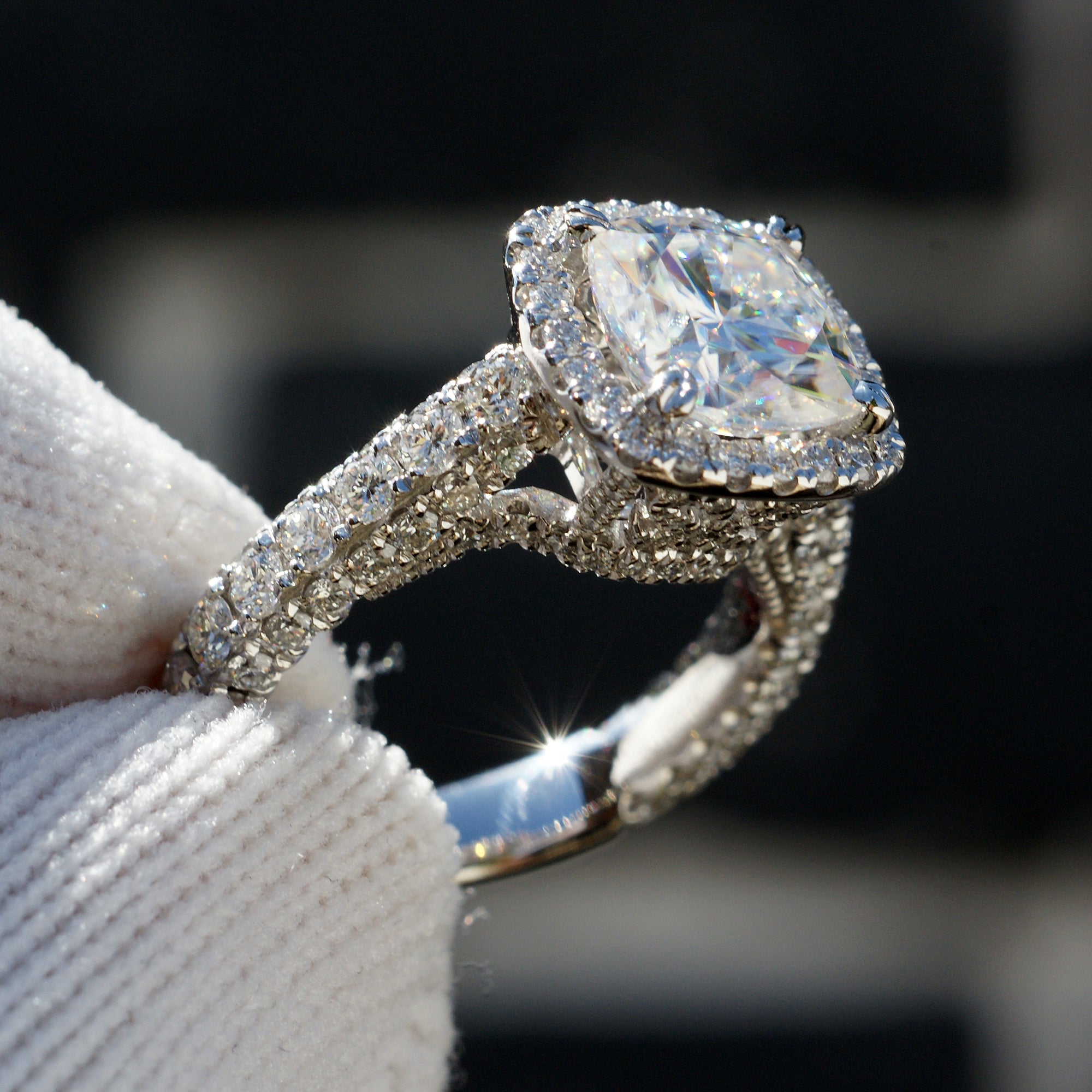 Cushion cut moissanite and diamond halo total drenched engagement ring in white gold