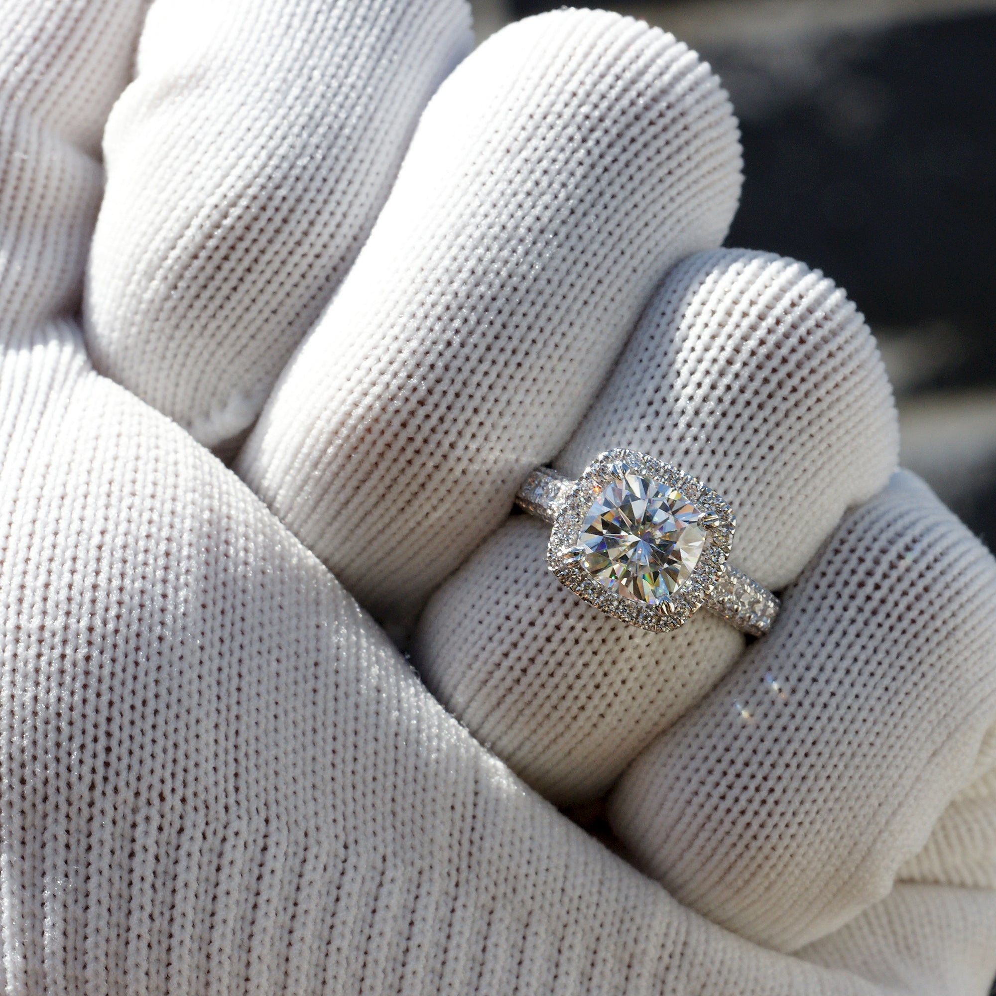 Cushion cut moissanite and diamond halo total drenched engagement ring in white gold
