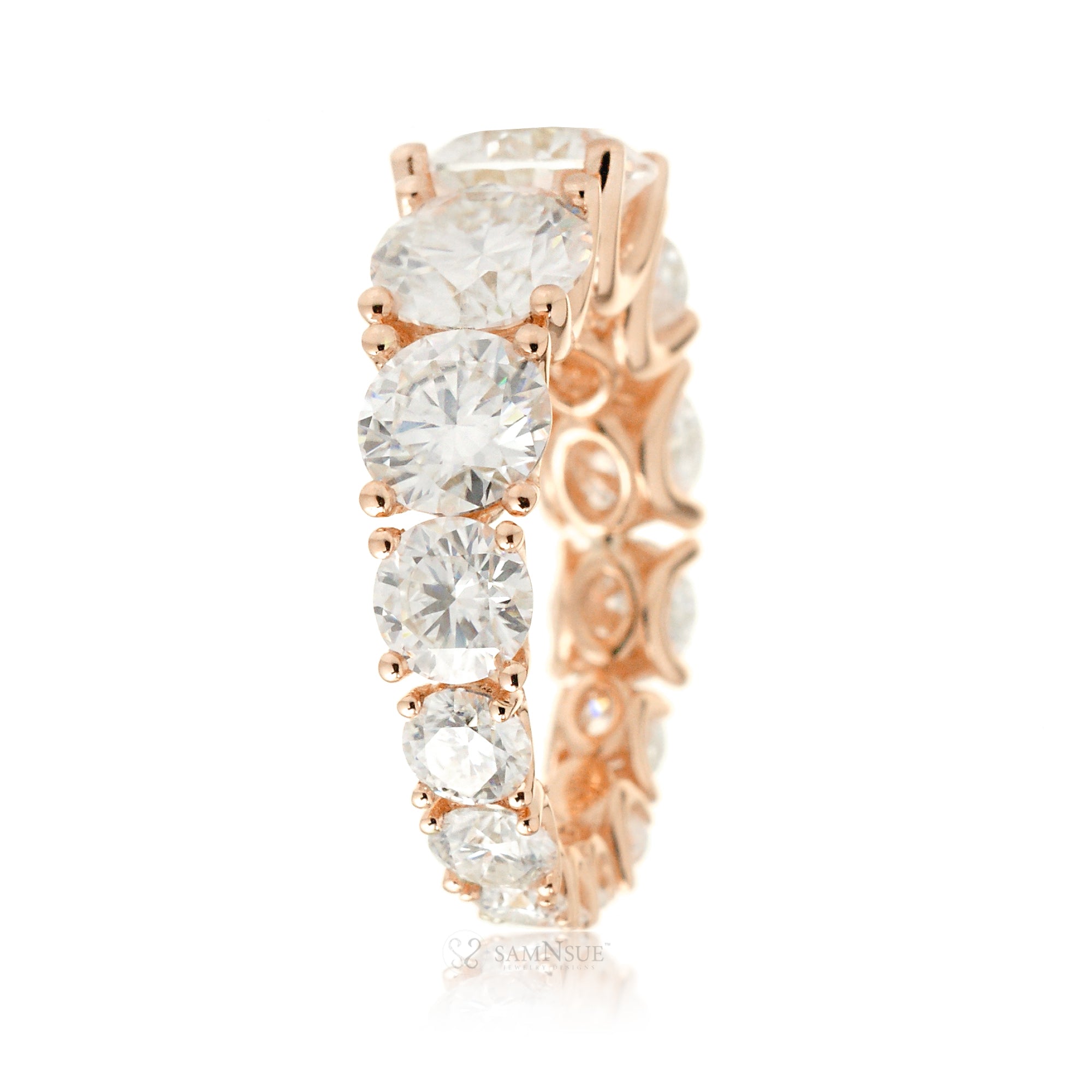 Graduated round moissanite eternity wedding anniversary band rose gold