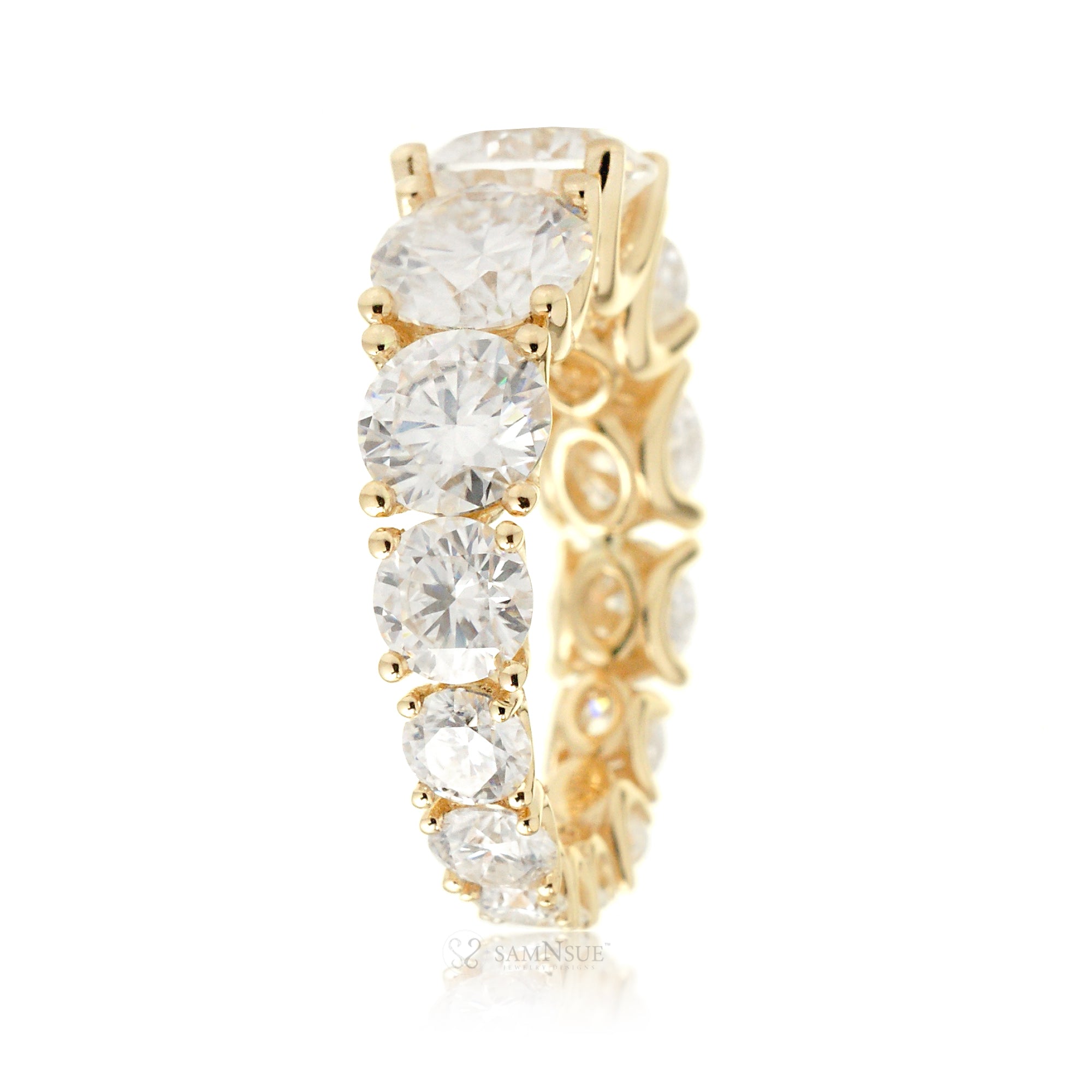 Graduated round moissanite eternity wedding anniversary band yellow gold