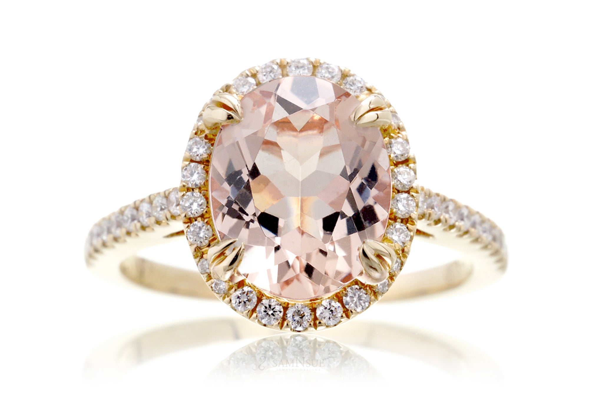 Oval morganite engagement ring with diamond halo in yellow gold